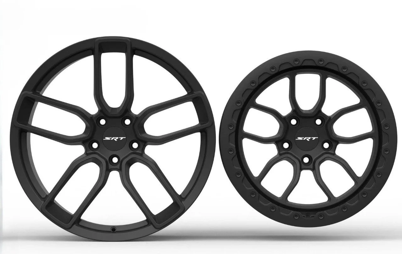 Two black alloy wheels with the SRT logo in the center, spaced apart on a plain white background.