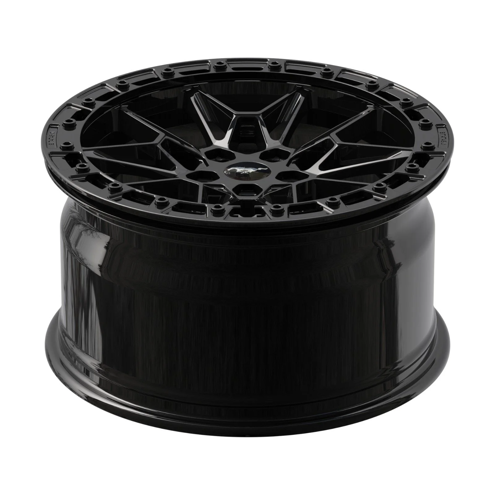A black car rim with a multi-spoke design resting on a black wheel box.