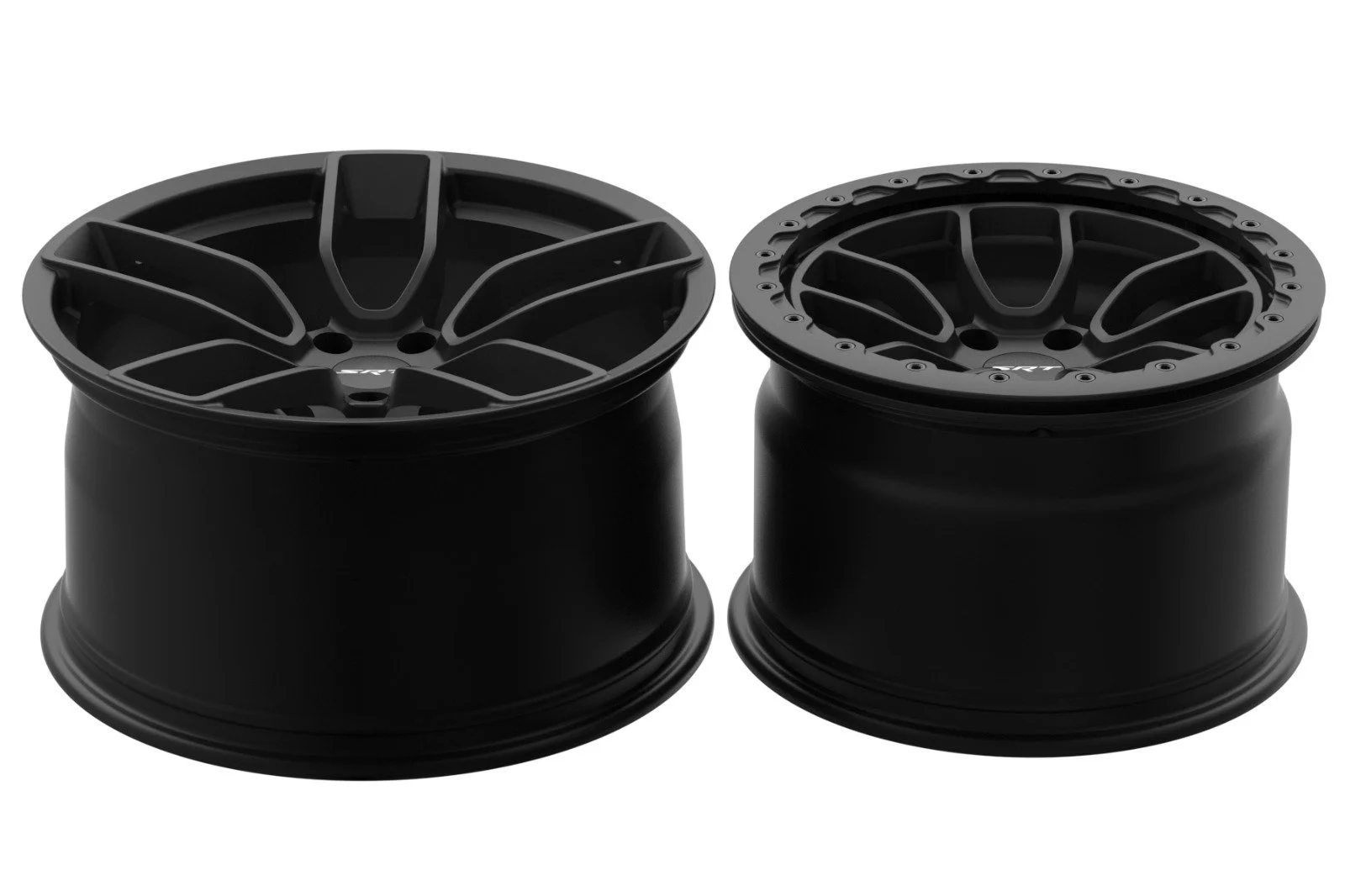 Two black car wheel rims viewed from the top against a white background.