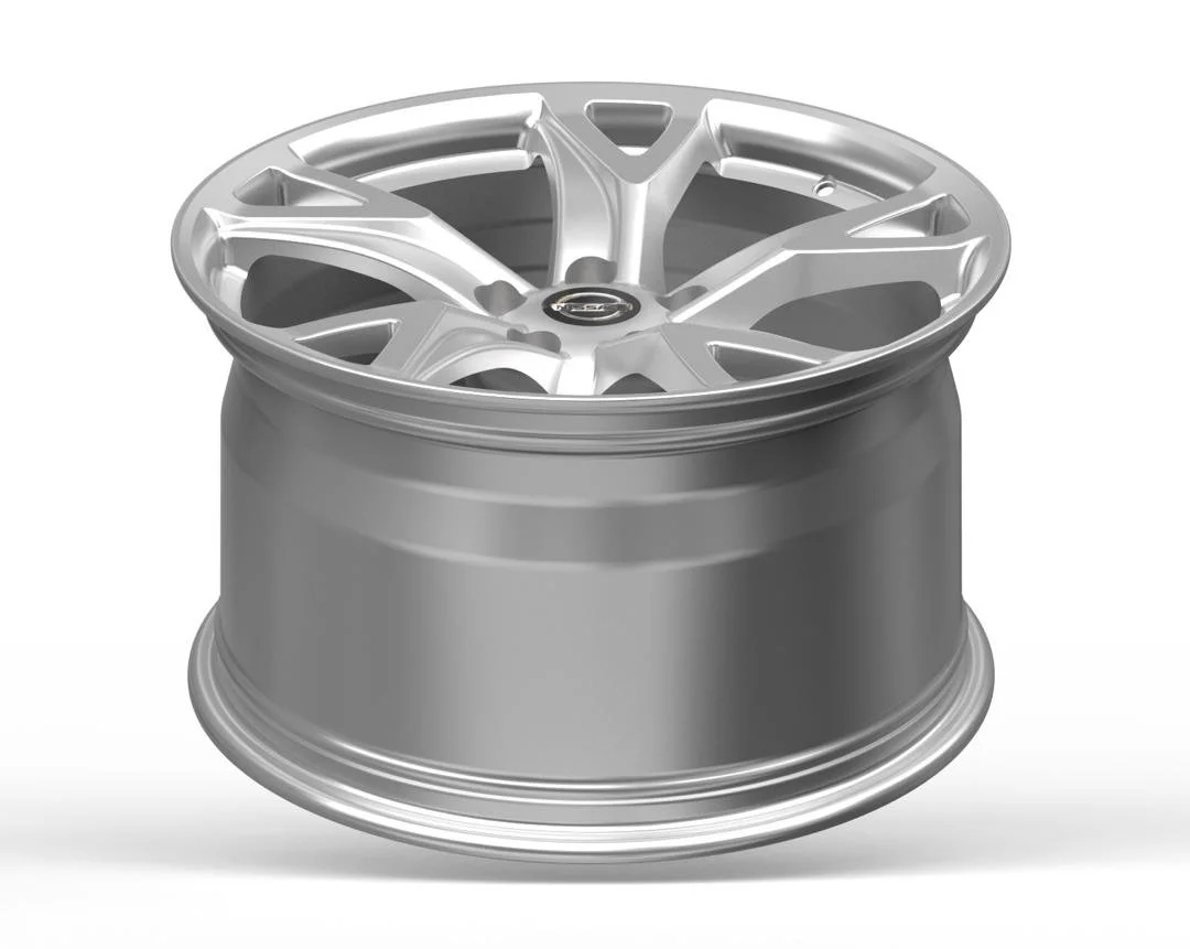A shiny silver alloy wheel rim placed on a cylindrical container or cover.