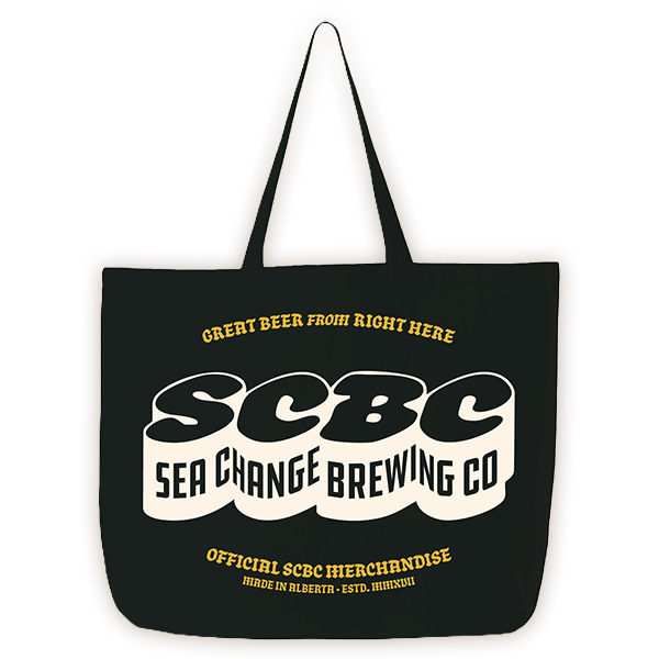 Black tote bag with yellow and white text promoting Sea Change Brewing Co, featuring the tagline "Great beer from right here" and "Official SBBC merchandise"