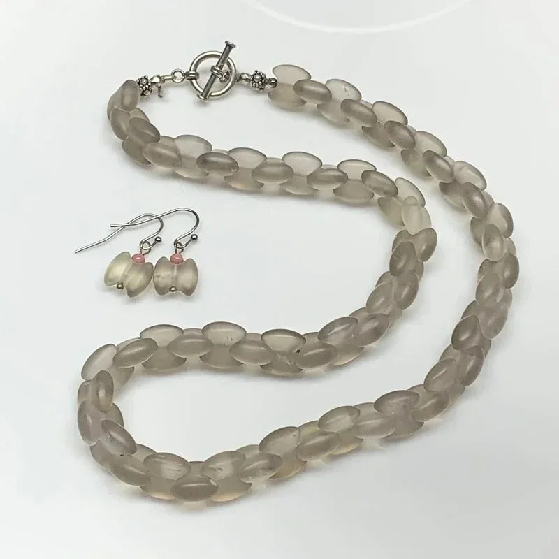Materials: Sterling Silver, Smokey Quartz and Rhodonite BeadsDimensions: "17 inch circumference."  Availability: "Private Collection."