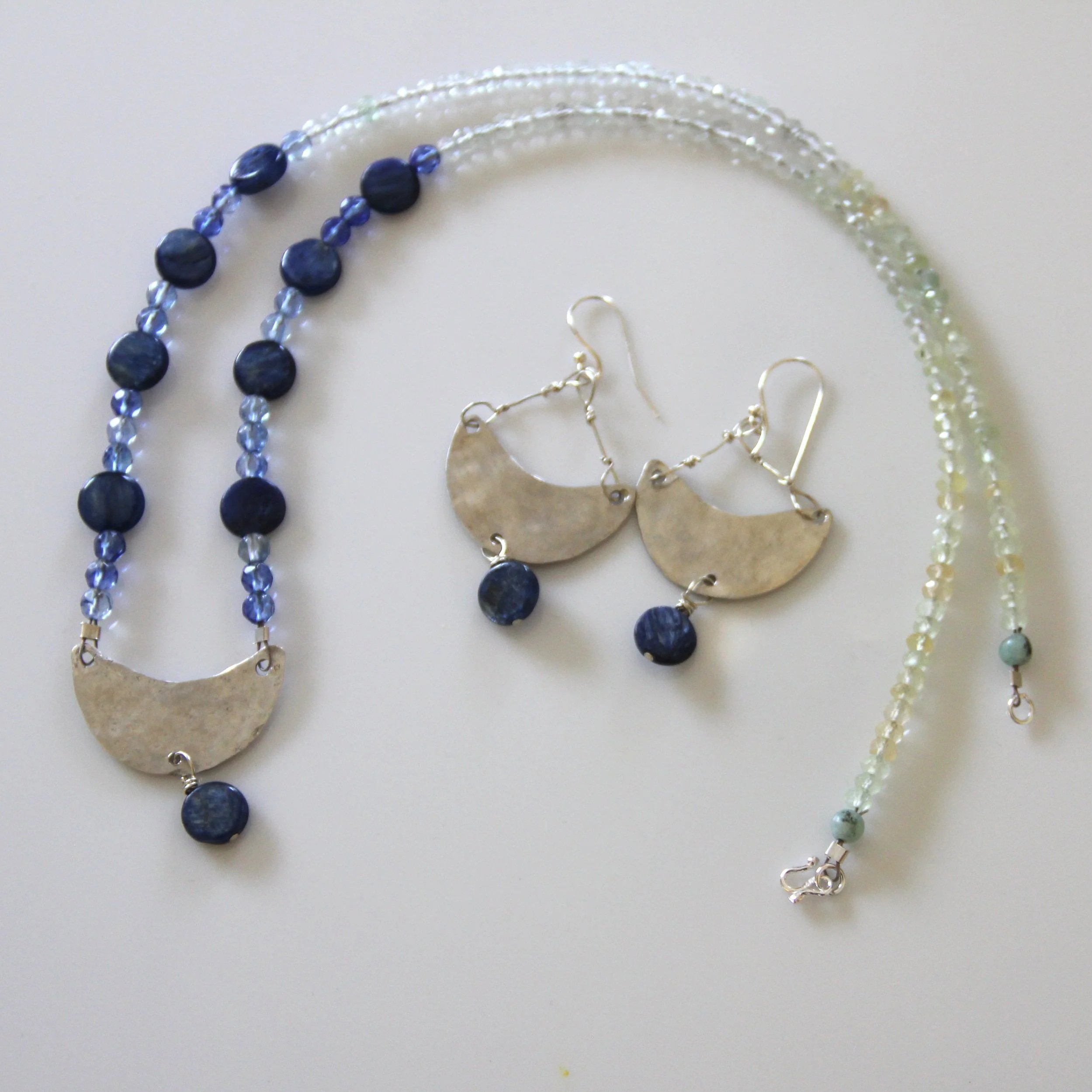 Materials: Sterling Silver, lapis and blue crystal beads.  Dimensions: "Adjustable" or "17-inch circumference"  Availability: "Private Collection"