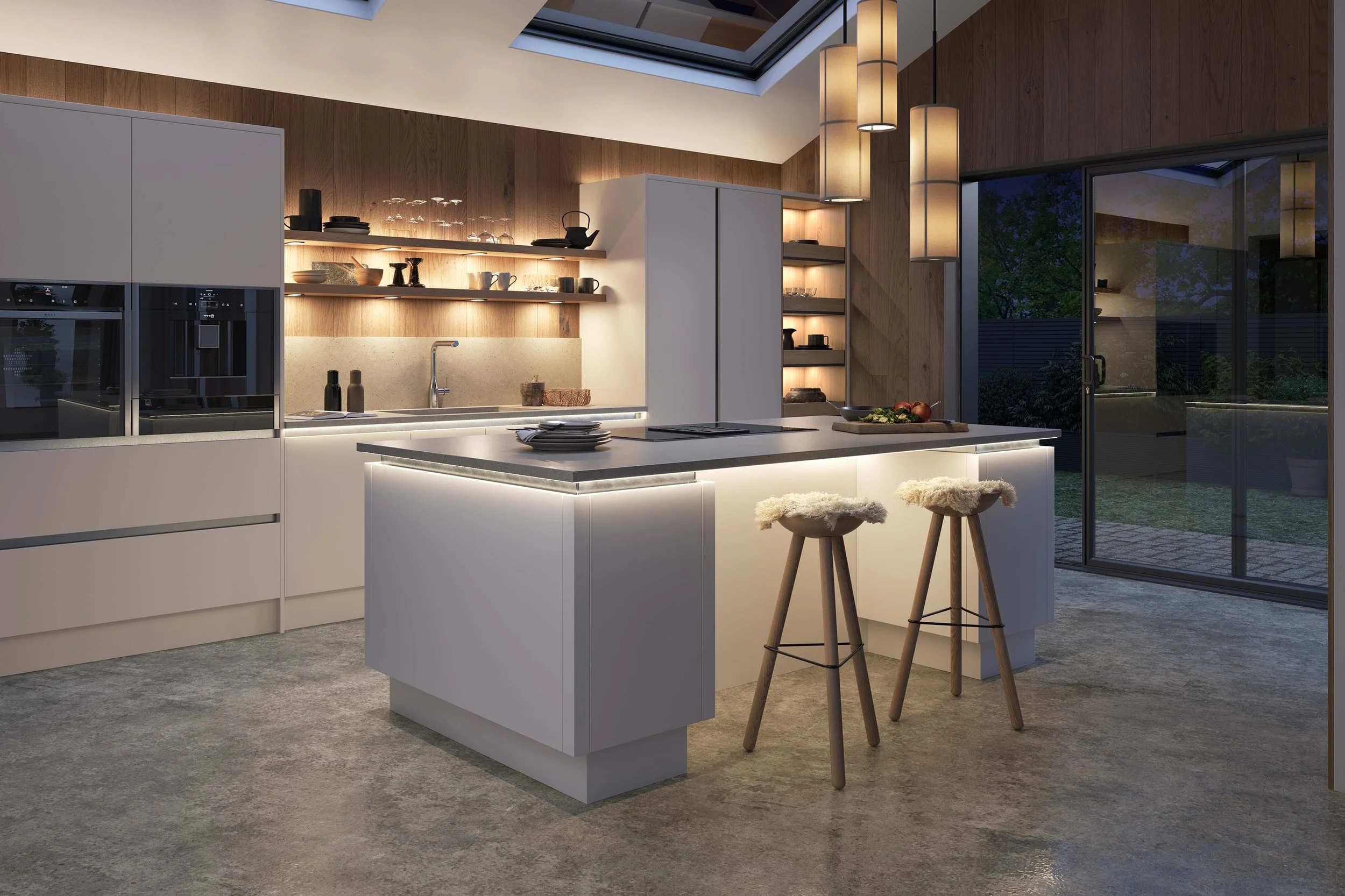 Modern kitchen with white cabinetry, open wooden shelves with dishes, and a kitchen island with bar stools. Skylight and large glass door view outside, with pendant lighting overhead.