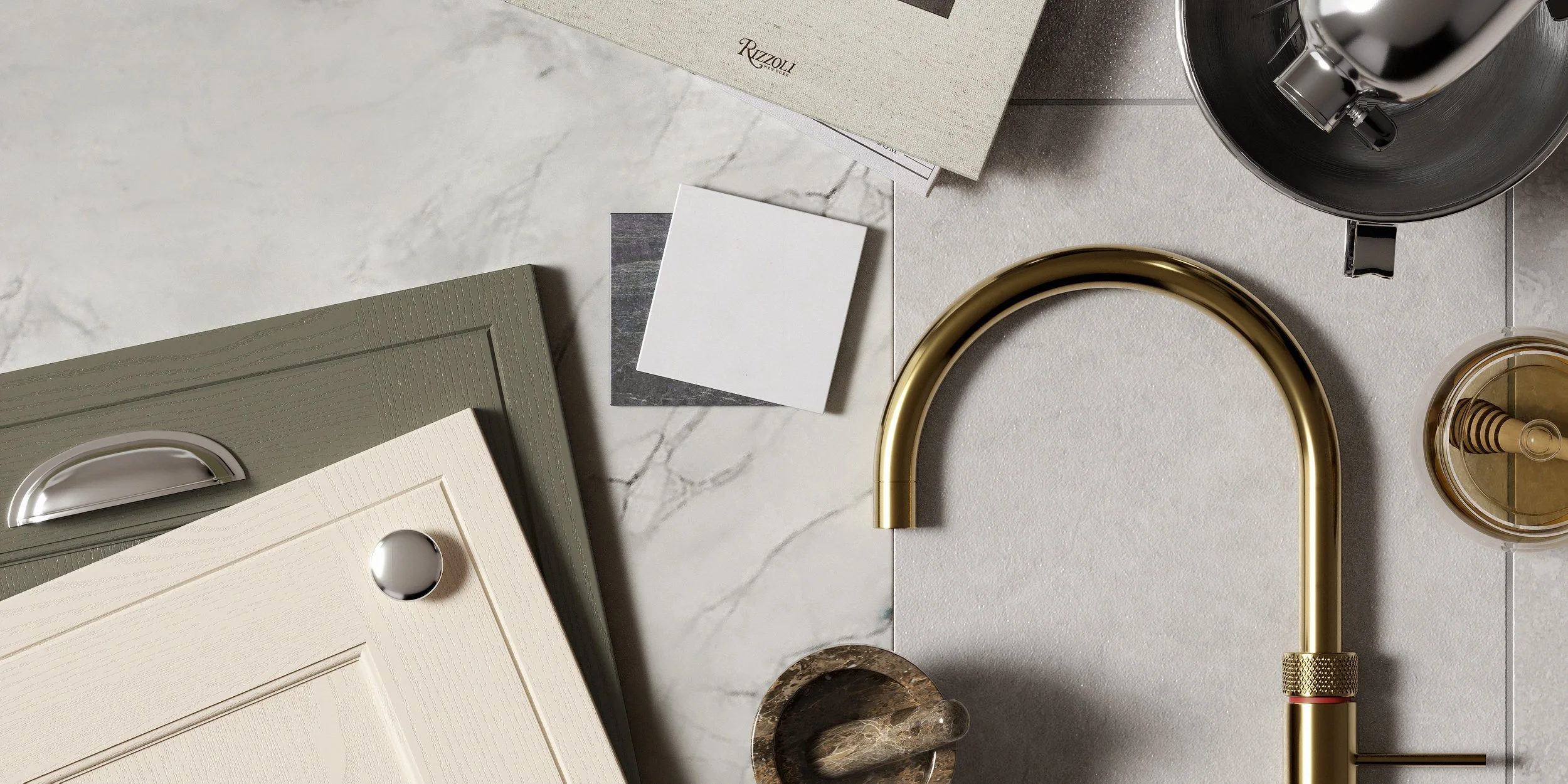 A flat lay of interior design samples including cabinet doors, color swatches, a marble tile, a gold kitchen faucet, a mixer attachment, a coffee cup with a lid, and a box of Rizzoli design books on a marble and textured surface.