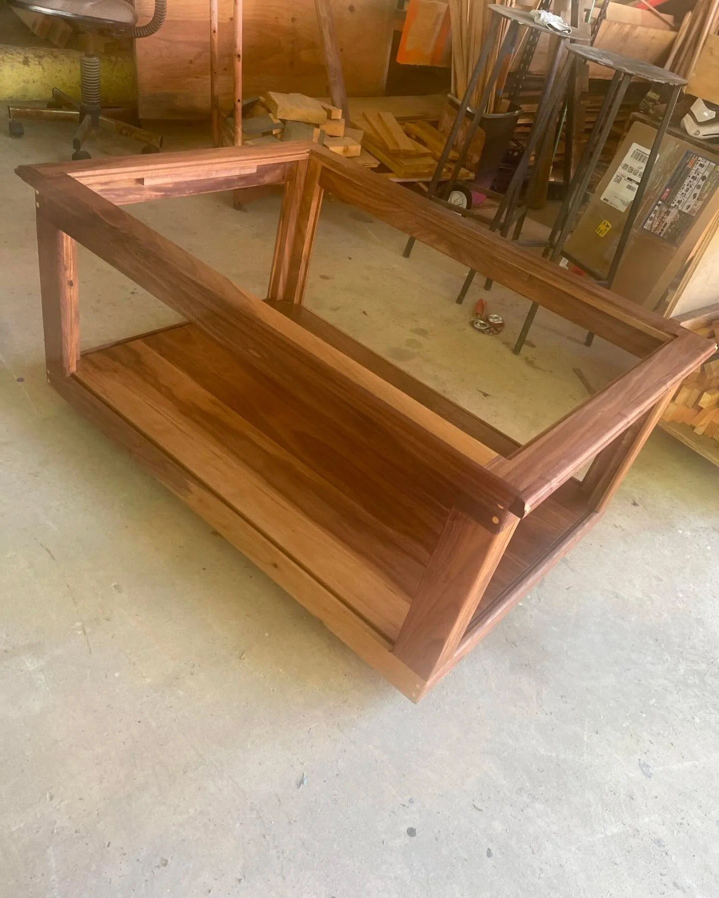 I had the pleasure to build an awesome coffee table. Great way to display whatever your heart desires. Made entirely of beautiful Walnut lumber. All tempered safety glass panels on the sides and top. Overall dimensions of this table are 40LX28W18H. O
