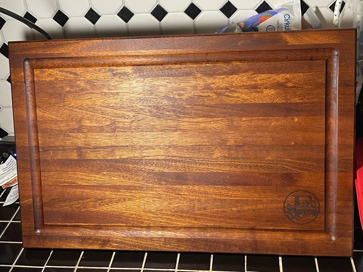 This is the second cutting board I make out of African Mahogany. I love the way to color pops when the oil is applied. This board is approximately 12in. x 18in. Added a monogram to give it a person touch. 

#woodworking #wood #handmade #woodworker #w