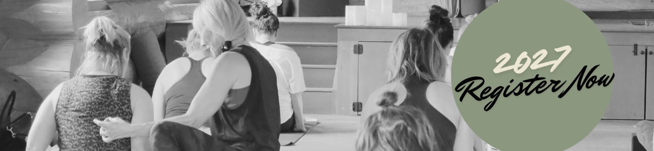 People sitting on the floor a yoga studio, during practice, with a green circle overlay containing the text "2027 Register Now."