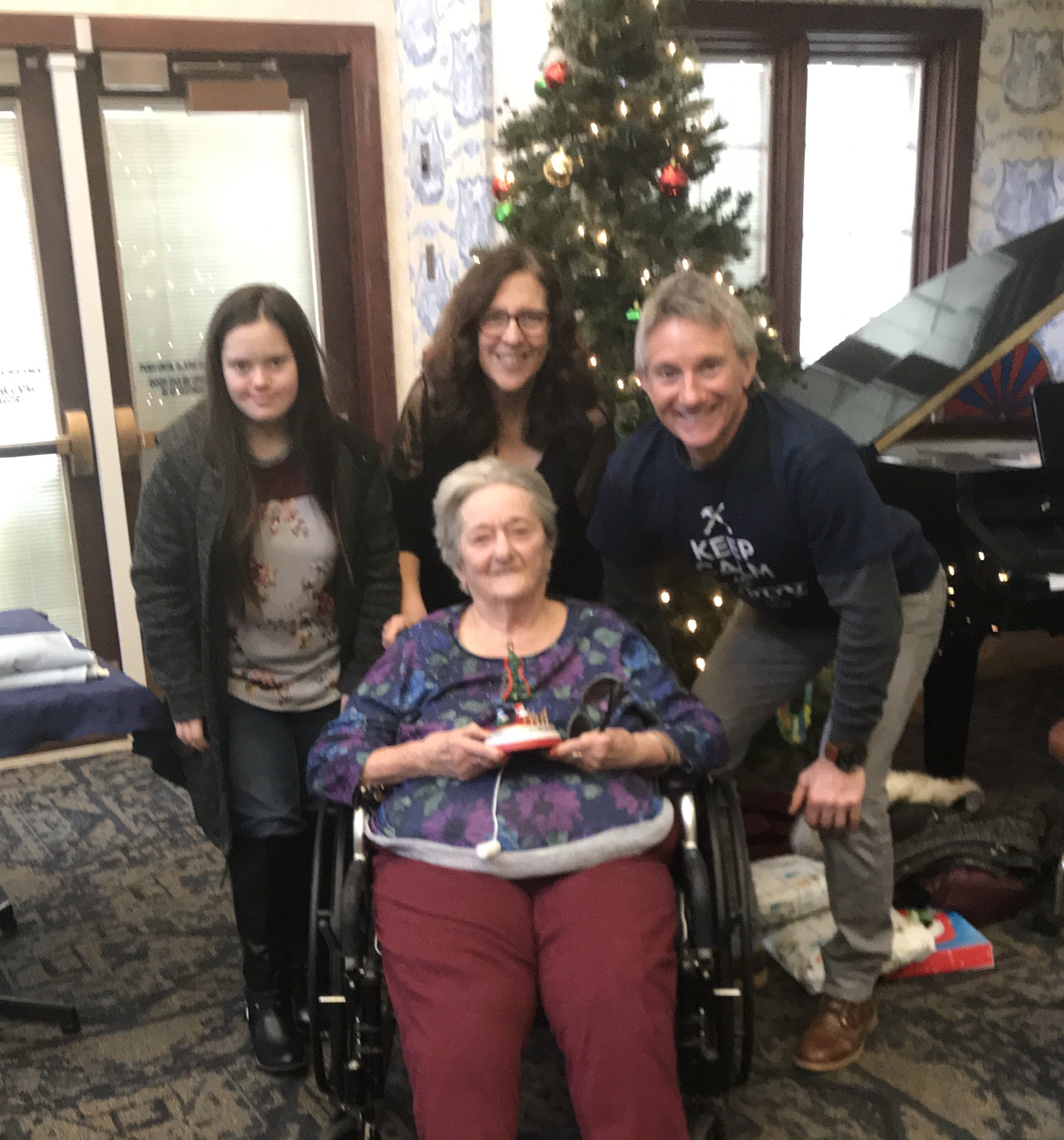 Multi-generational family visit at a senior care residence with the Barclay family.