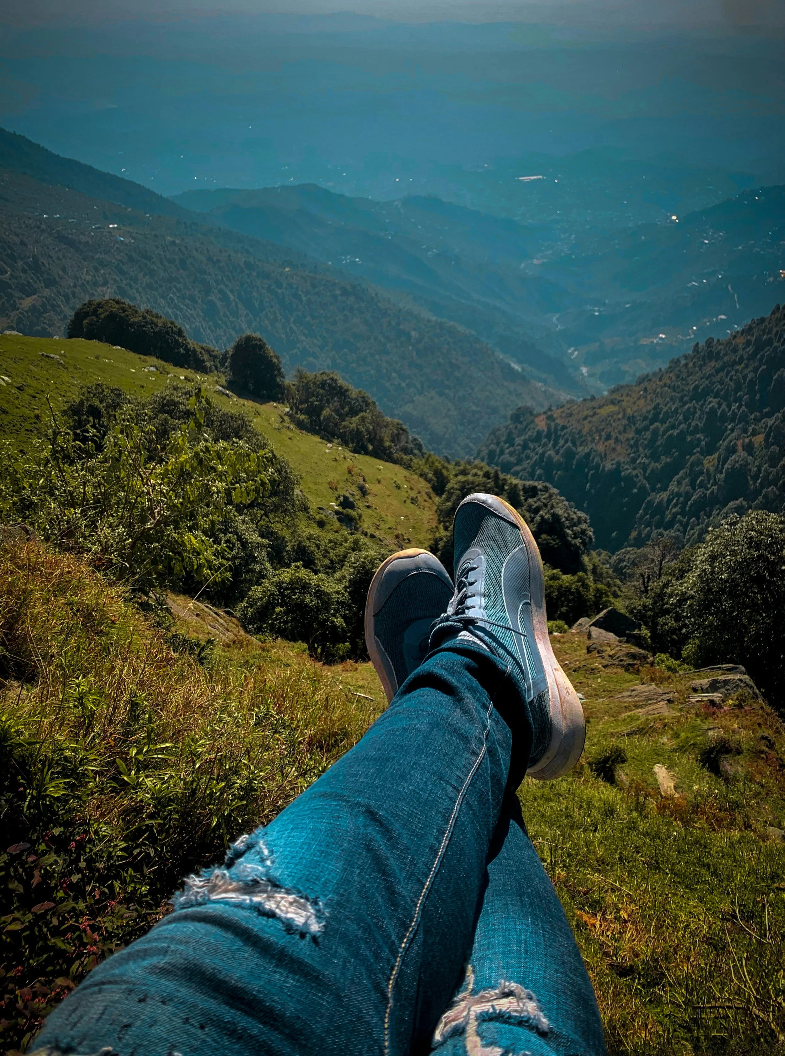 A person on top of a mountain overlooking amazing views.