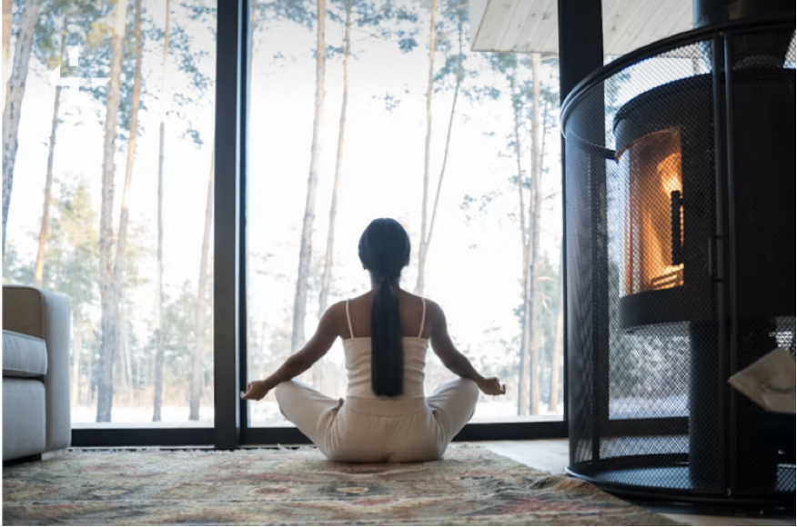 A woman meditating  in a peaceful room