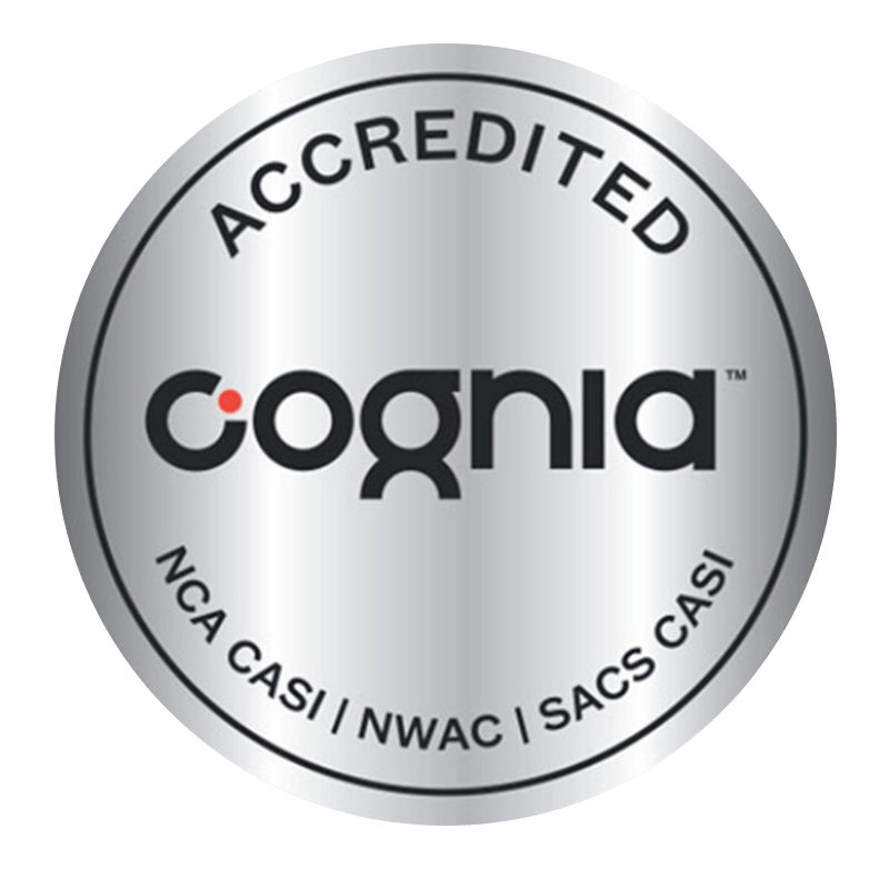Silver circular badge with black text that reads "Accredited Cognia" and lists accreditation types: NCA CASI, NWAC, SACS CASI.
