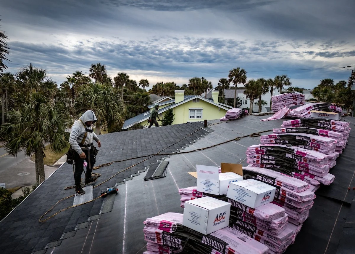 Working on the roof with shingle
