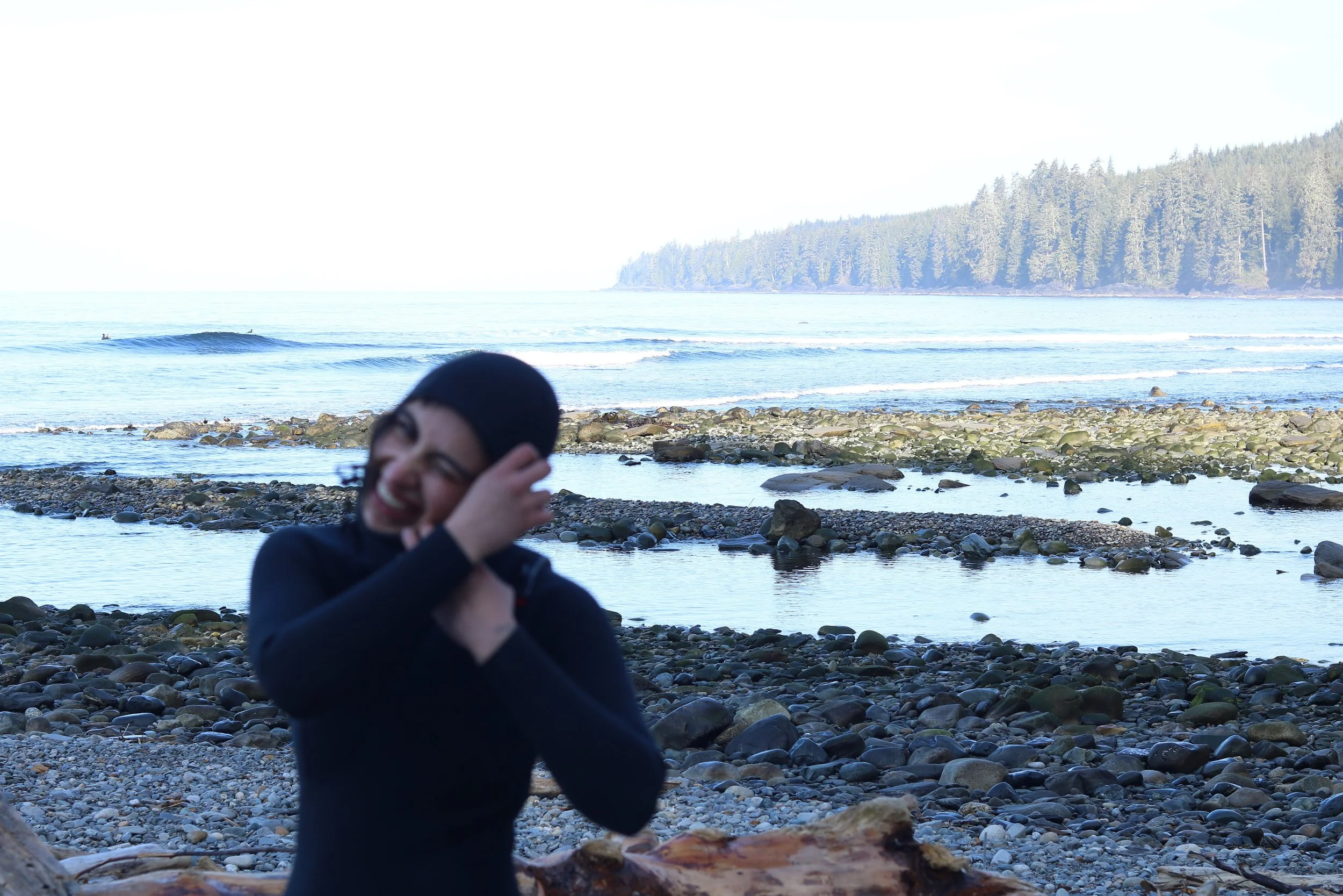 Holistic healing practitioner in Tofino by the ocean representing balance, wellness, and qi gong treatment