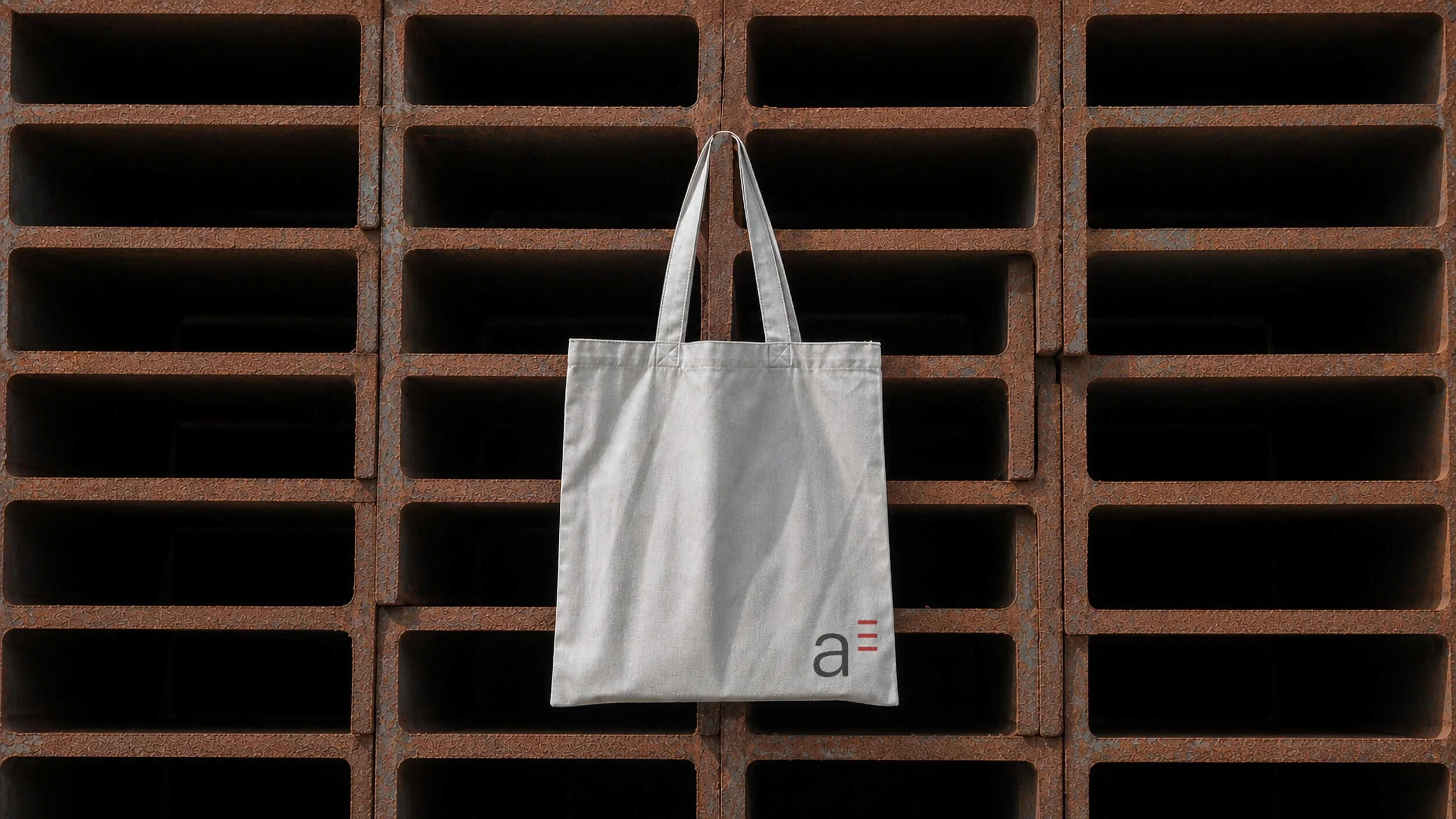 Branded tote bag designed for a construction company visual identity.