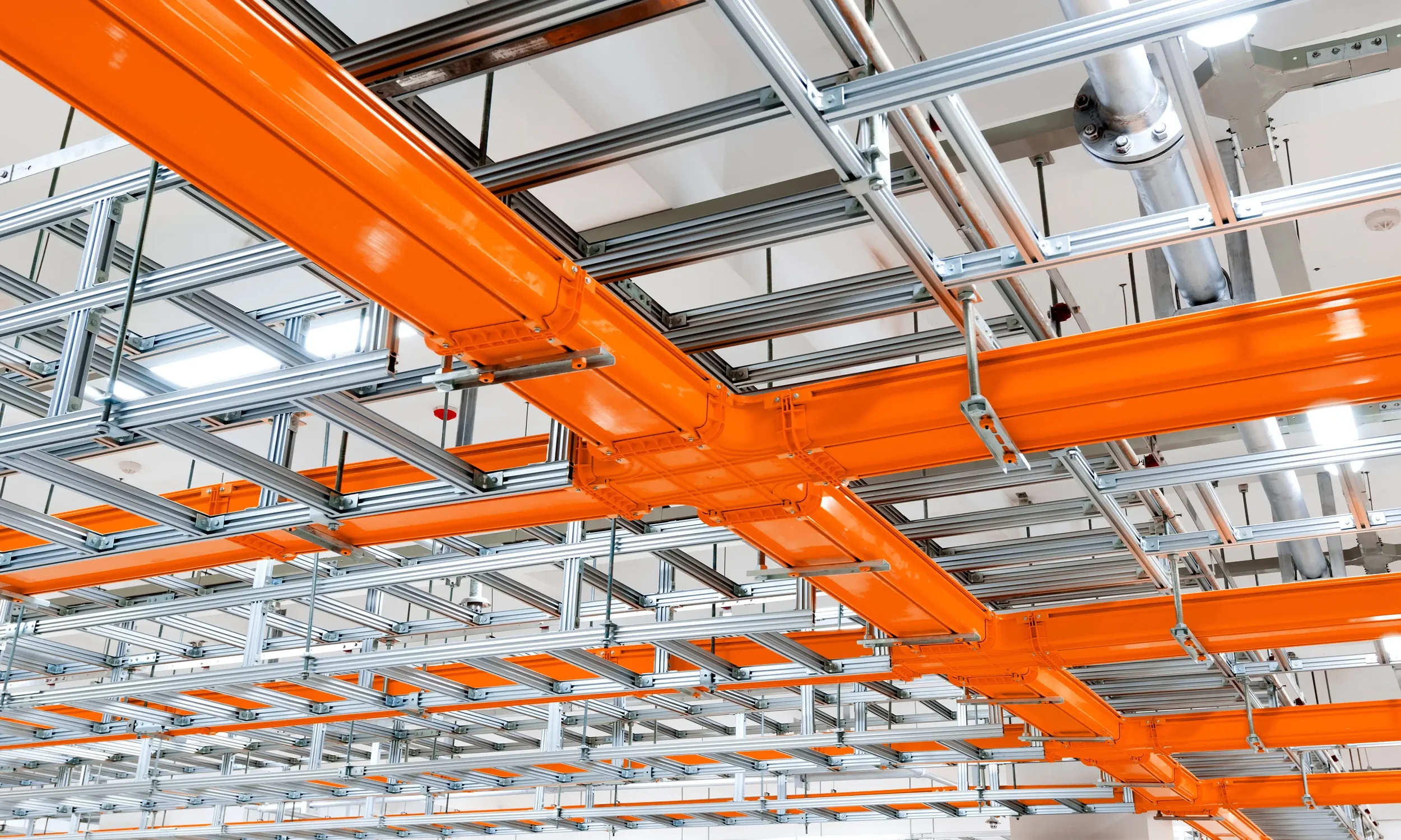 Industrial infrastructure photography with orange brand accent