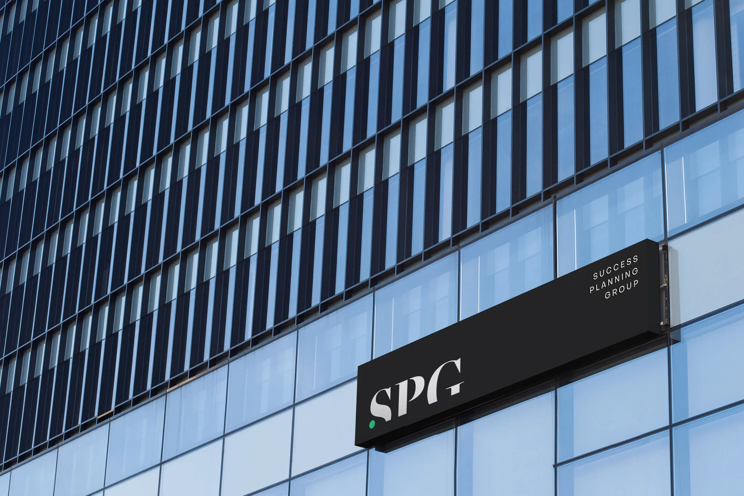 Corporate building signage for a financial services brand identity project.