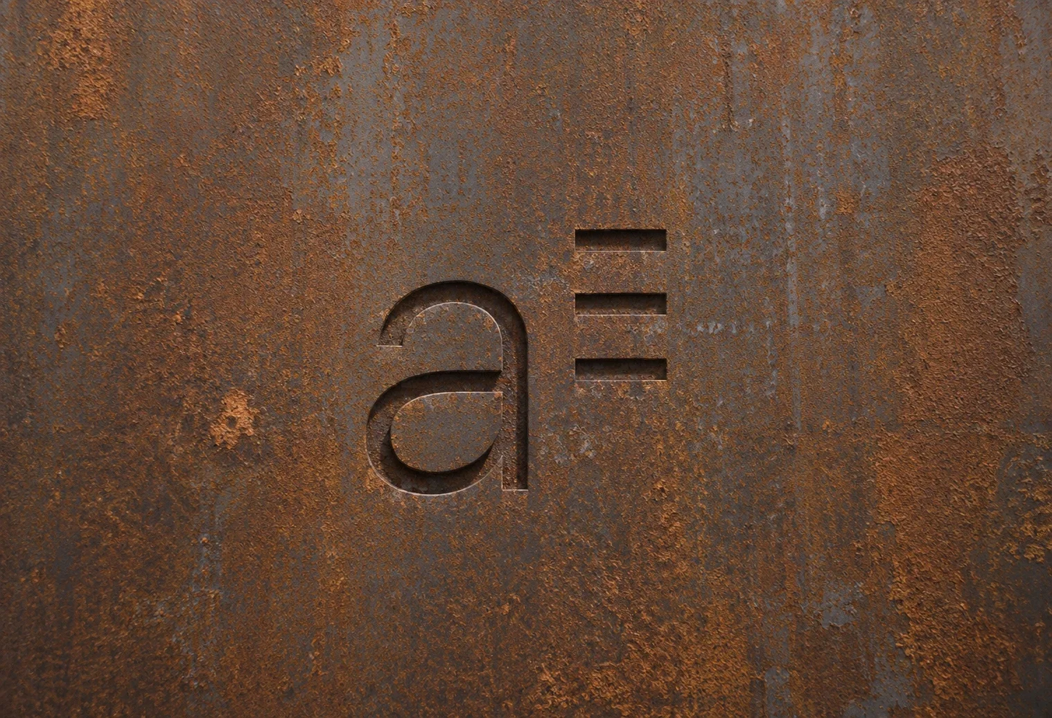Exterior architectural signage displaying a construction company logo and brand identity.