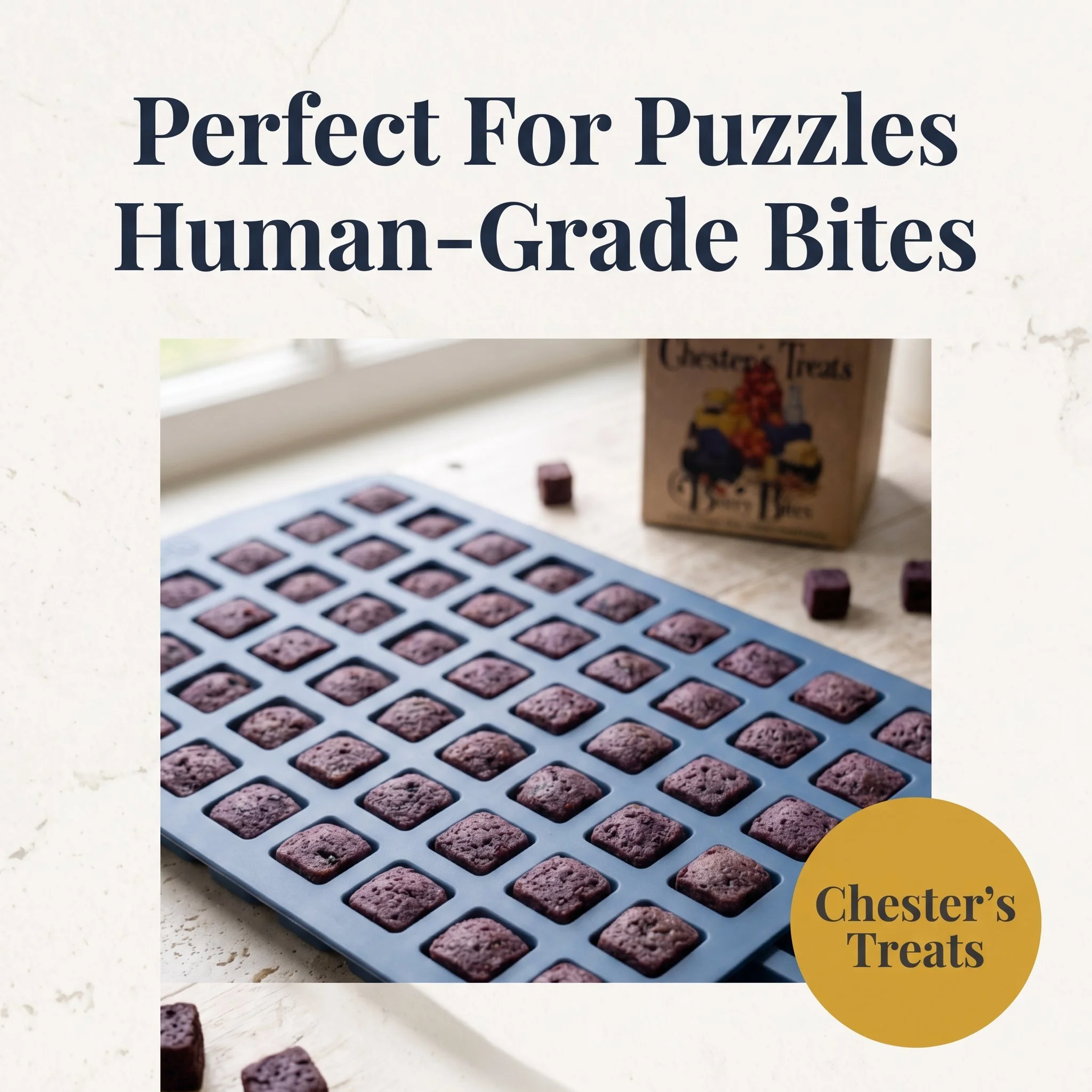 Close-up view of a tray of small, square-shaped purple cookies with a cracked surface, with a partially visible box of chocolate treats in the background. Text overlay reads 'Perfect For Puzzles Human-Grade Bites' and a yellow circle in the corner sa