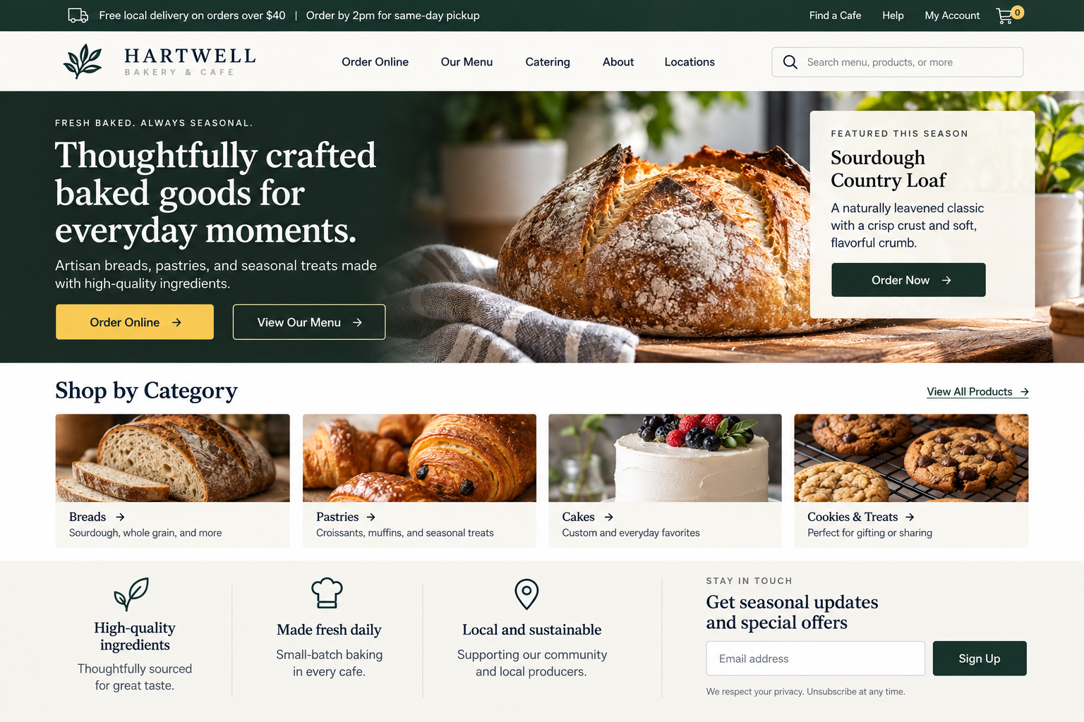 Homepage of Hartwell Bakery & Cafe website featuring a loaf of sourdough bread with a crusty top, positioned on a wooden surface with a gray towel nearby.