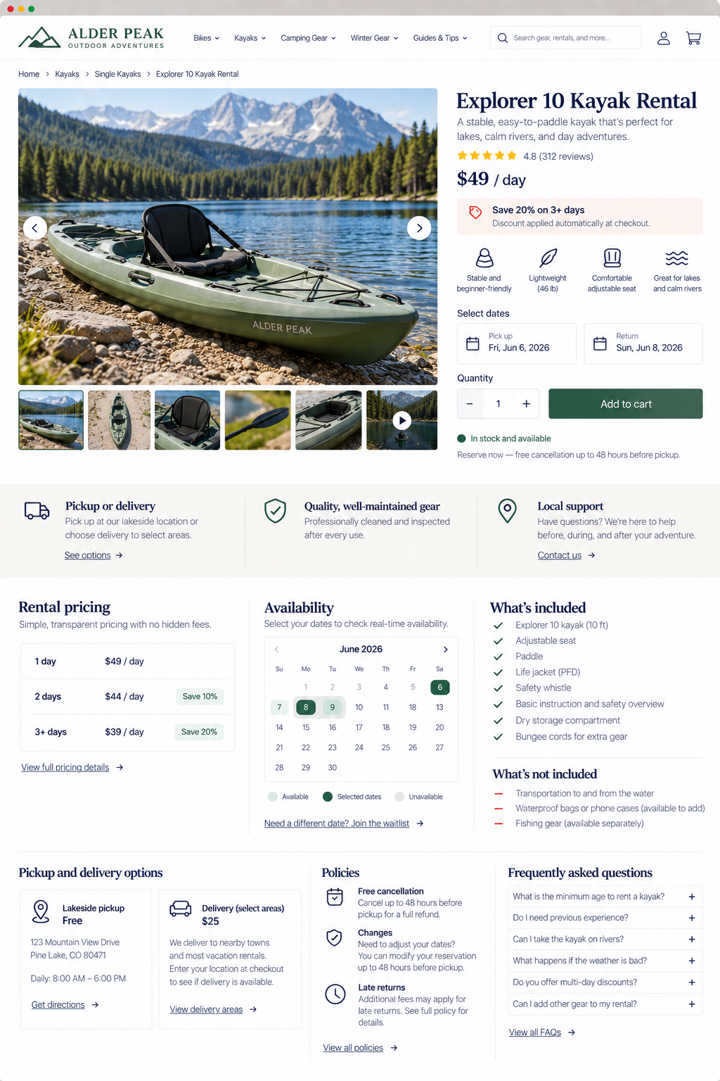 A green kayak on a rocky shoreline with mountains, a lake, and pine trees in the background.