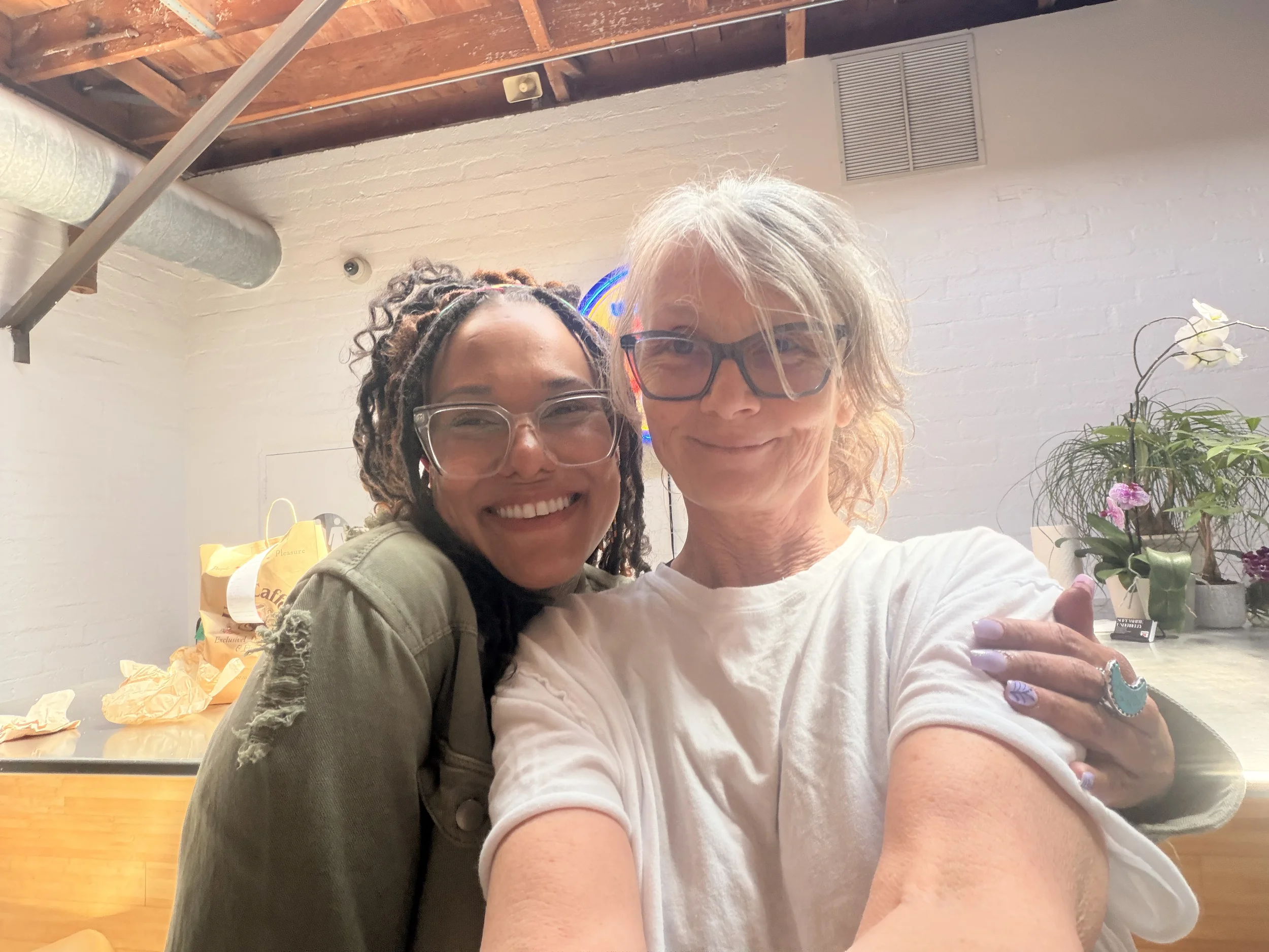 Lavender initiative founder hugging another person within the organization.