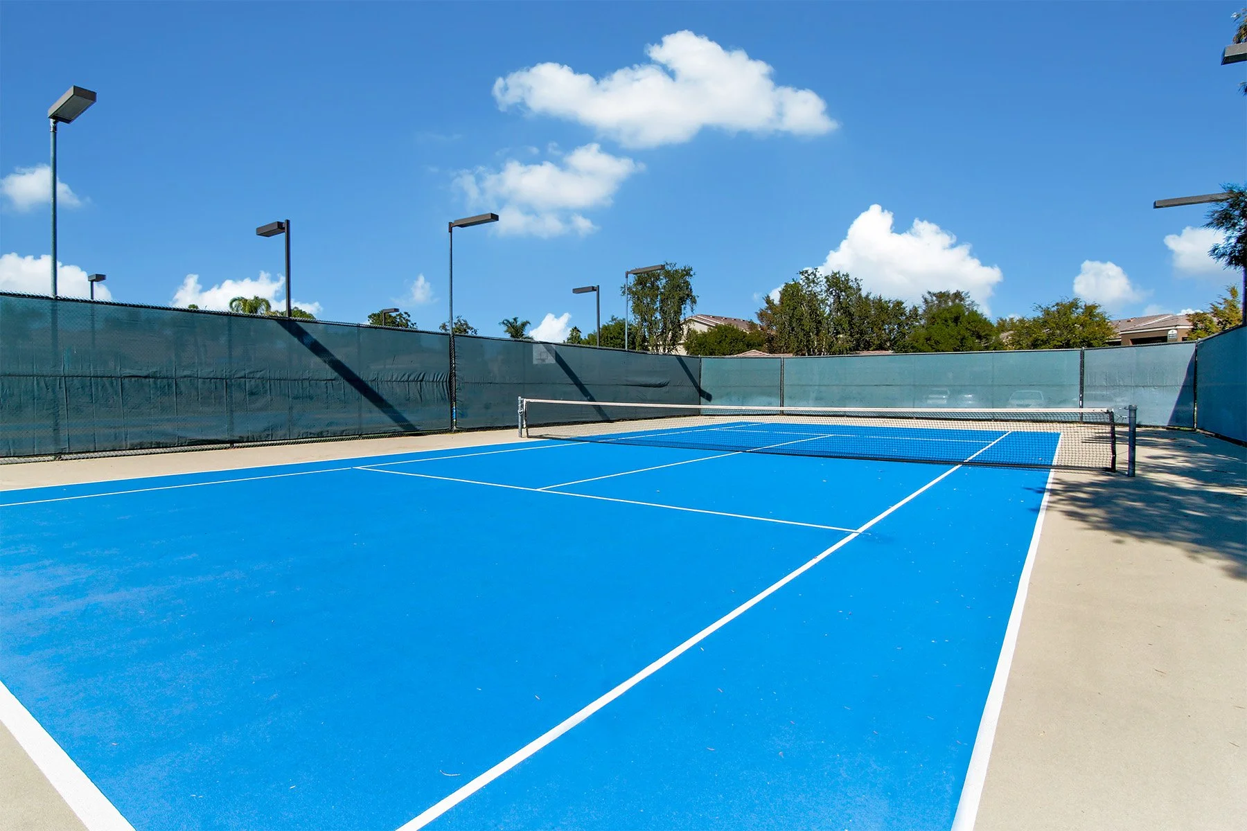 A photo of the tennis courts at The Enclave