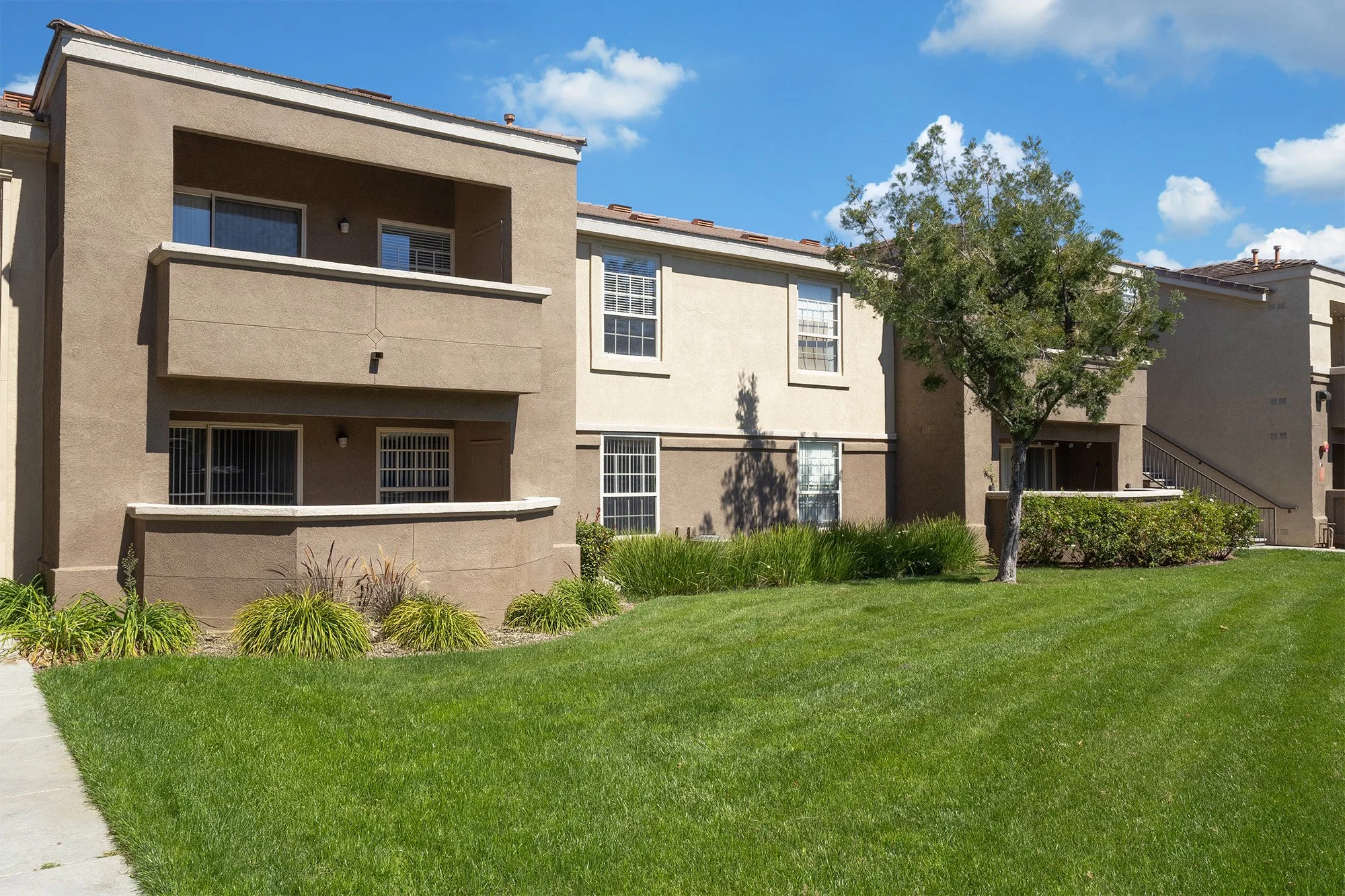 The Enclave Exterior Building and lush landscaping