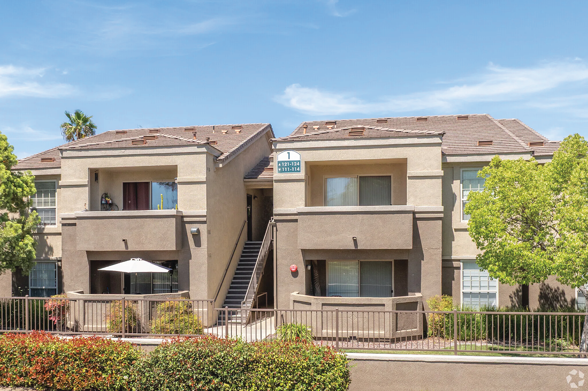An exterior photo of The Enclave apartment building