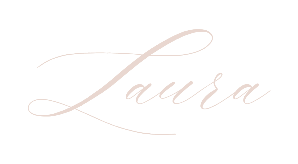 Elegant logo with the name 'Laura' written in cursive, beige-colored letters with decorative flourishes.