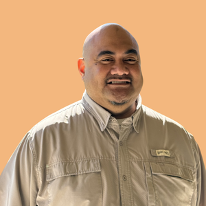 Portrait of a smiling man with a light collared shirt on