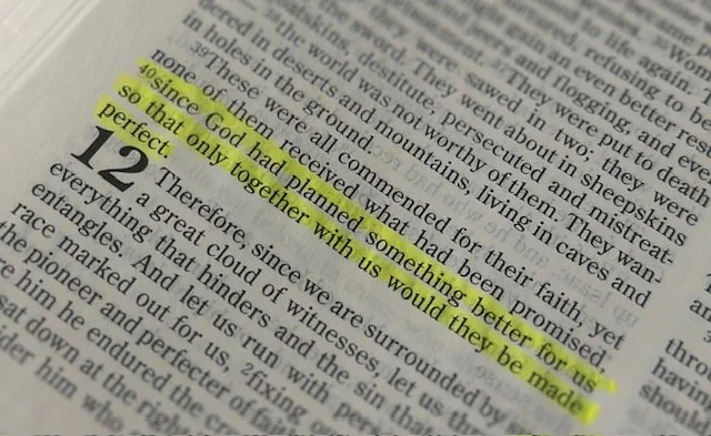 Close-up photo of a book page with highlighted text in yellow, discussing plans and promises.