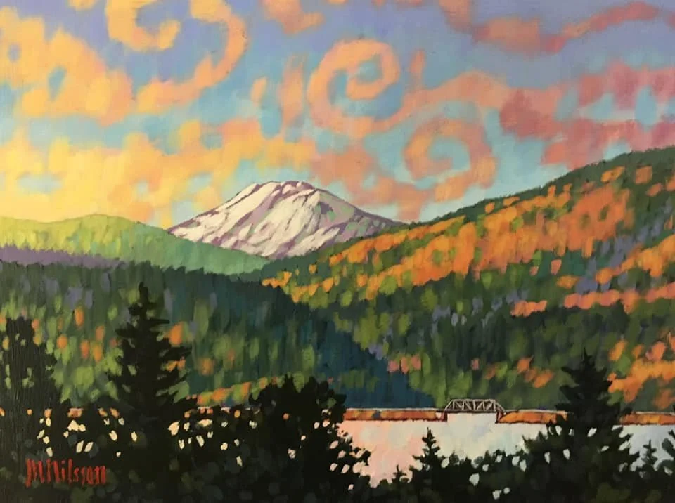 Painted landscape of a mountain with snow at the peak, surrounded by colorful trees in autumn, a river in the foreground, and a bridge crossing the river, with a sky filled with swirling clouds. Mark Nilsson ©