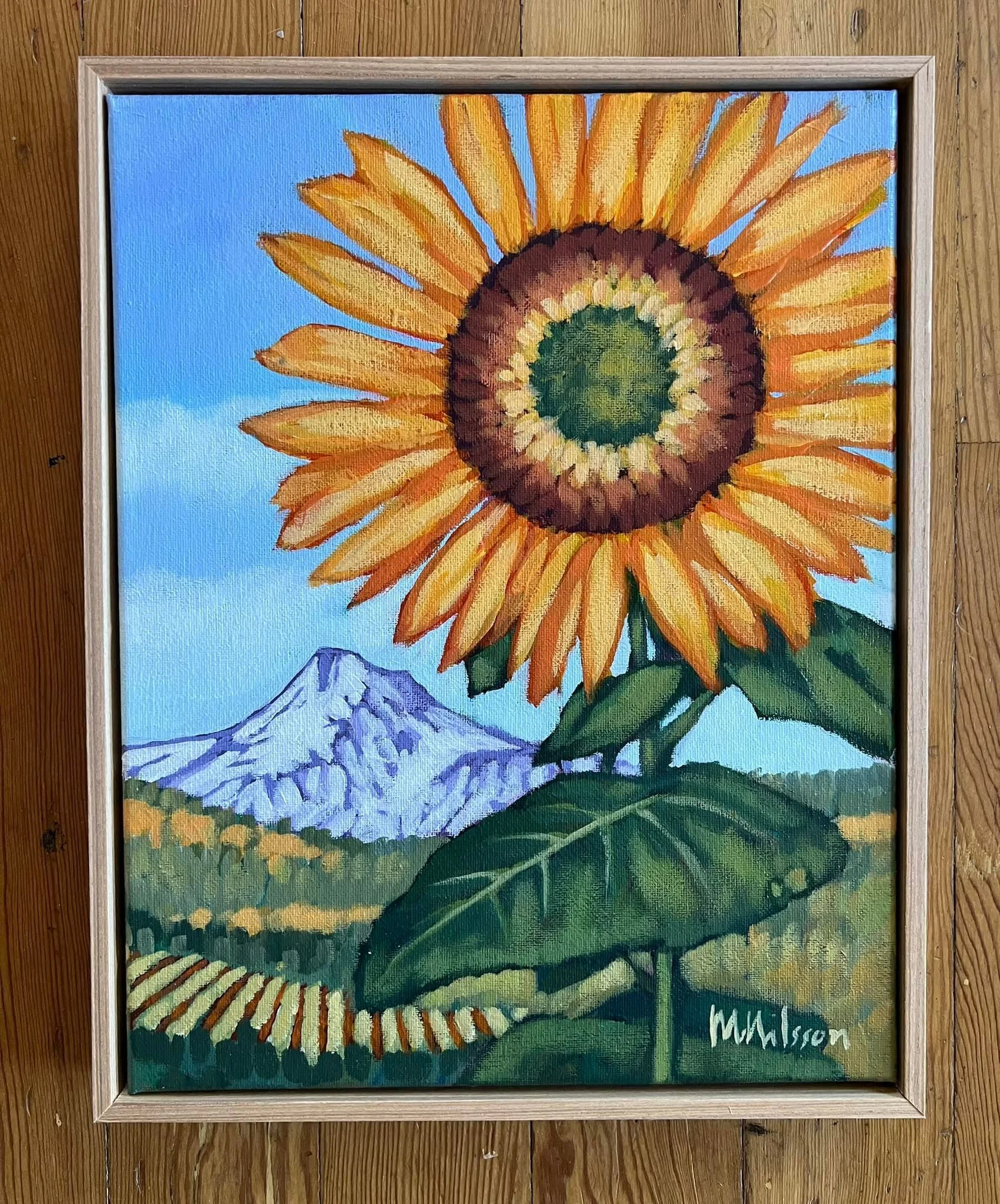 A colorful painting of a sunflower with a mountain in the background, signed by M. Moulson. Mark Nilsson ©