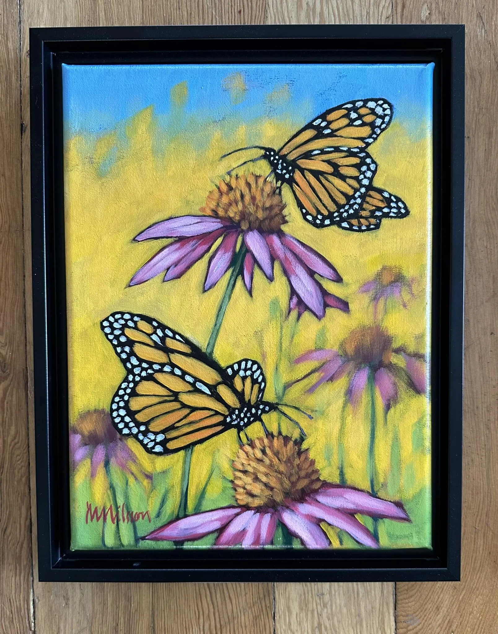 Painting of two Monarch butterflies hovering over pink coneflowers with a yellow and blue sky background.