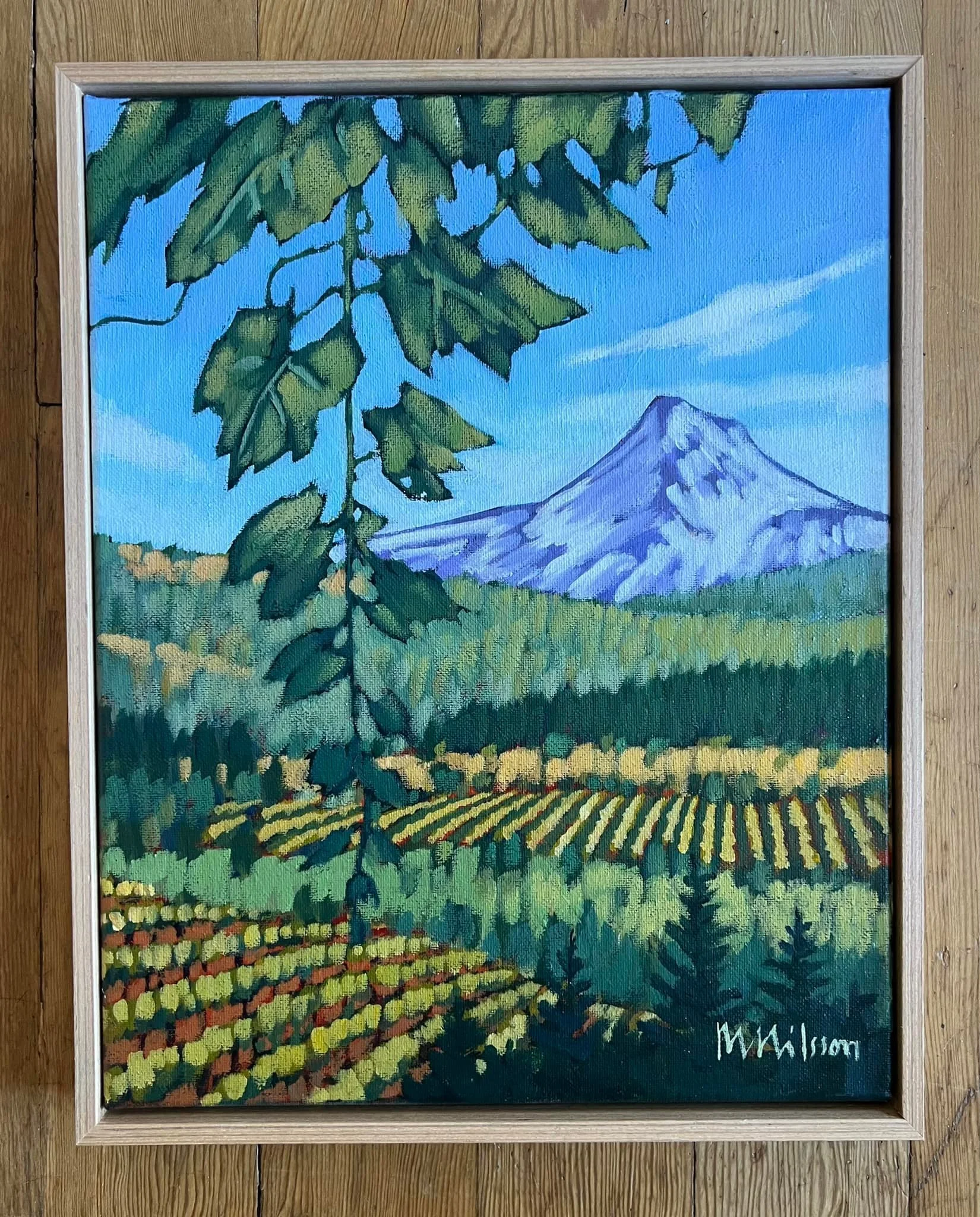 Painting of Mount Fuji in the background with green hills, trees, and a vineyard in the foreground, signed by M. Malcolm. Mark Nilsson ©