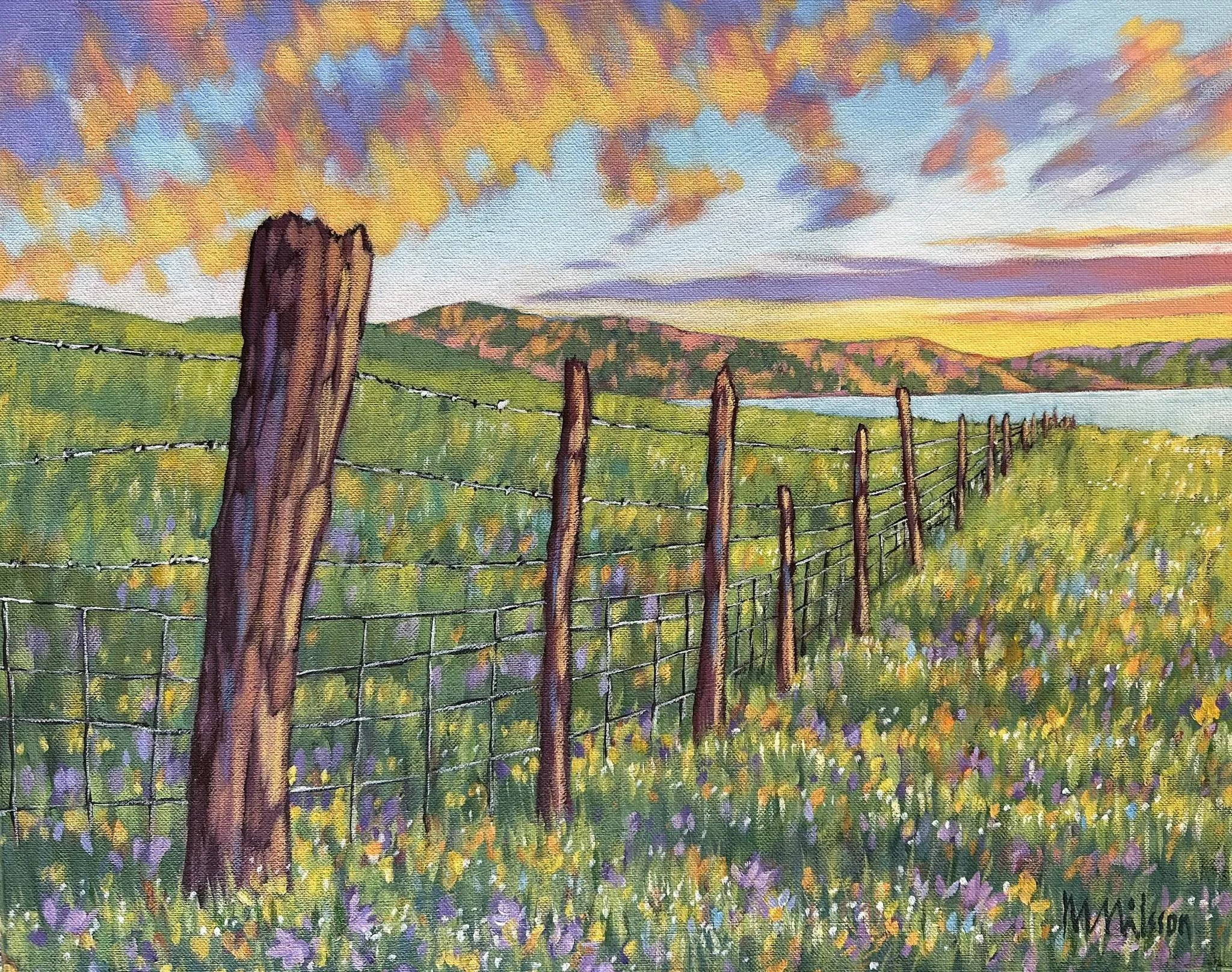 A painting of a countryside scene at sunset with a barbed wire fence, green rolling hills, a distant lake, colorful flowers in the foreground, and a vibrant sky with orange, purple, and blue clouds.