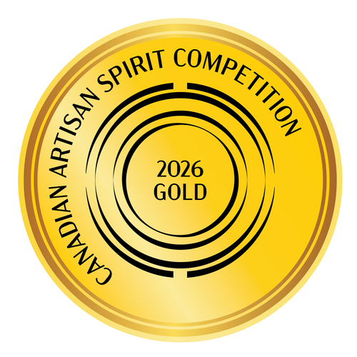 Gold circular badge with black text reading 'Canadian Artisan Spirit Competition' and '2026 Gold' in the center, with concentric black circles and a stylized design.