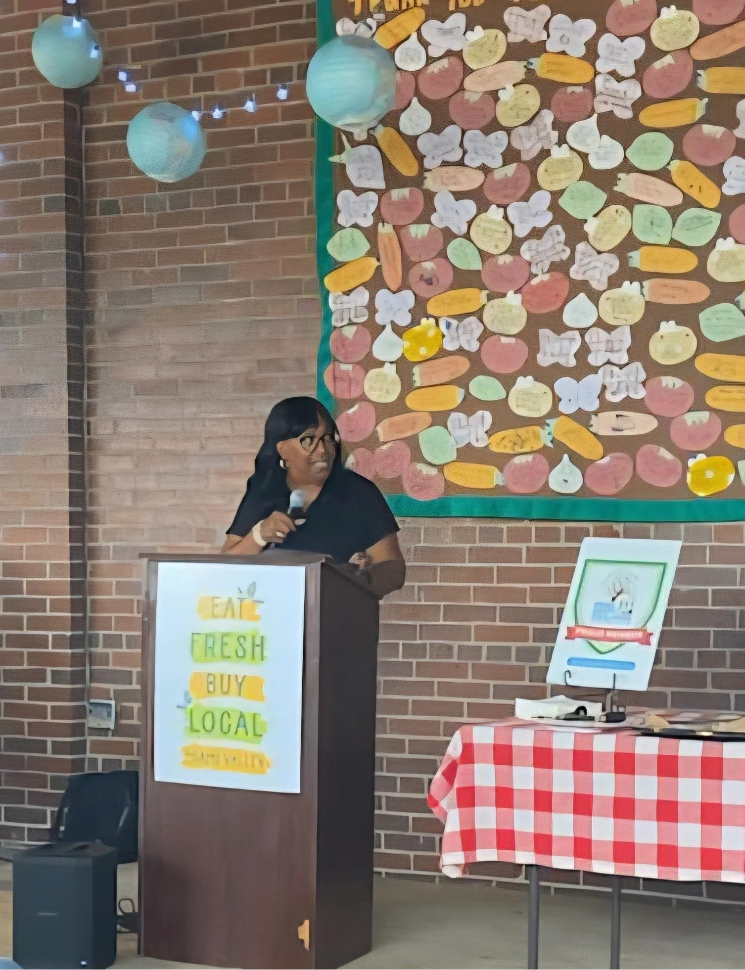 Efinity Harvest co founder Cheryl Wheeler speaking at 2nd Street Market in Dayton, Ohio advocating for fresh food access and supporting local farmers and community food systems