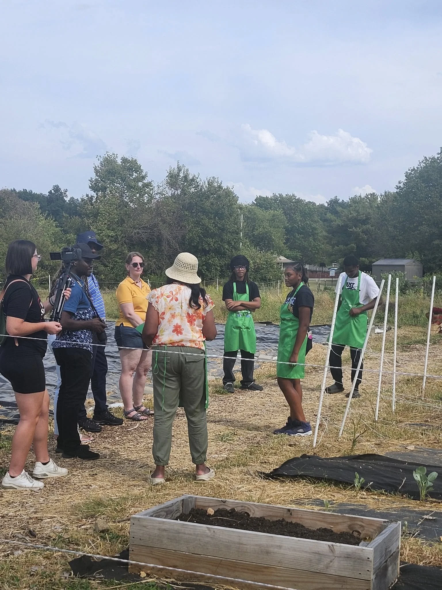 Youth participants and community members engaged in hands on urban farming training at Efinity Harvest Farm in Trotwood, Ohio supporting agriculture education and community food systems