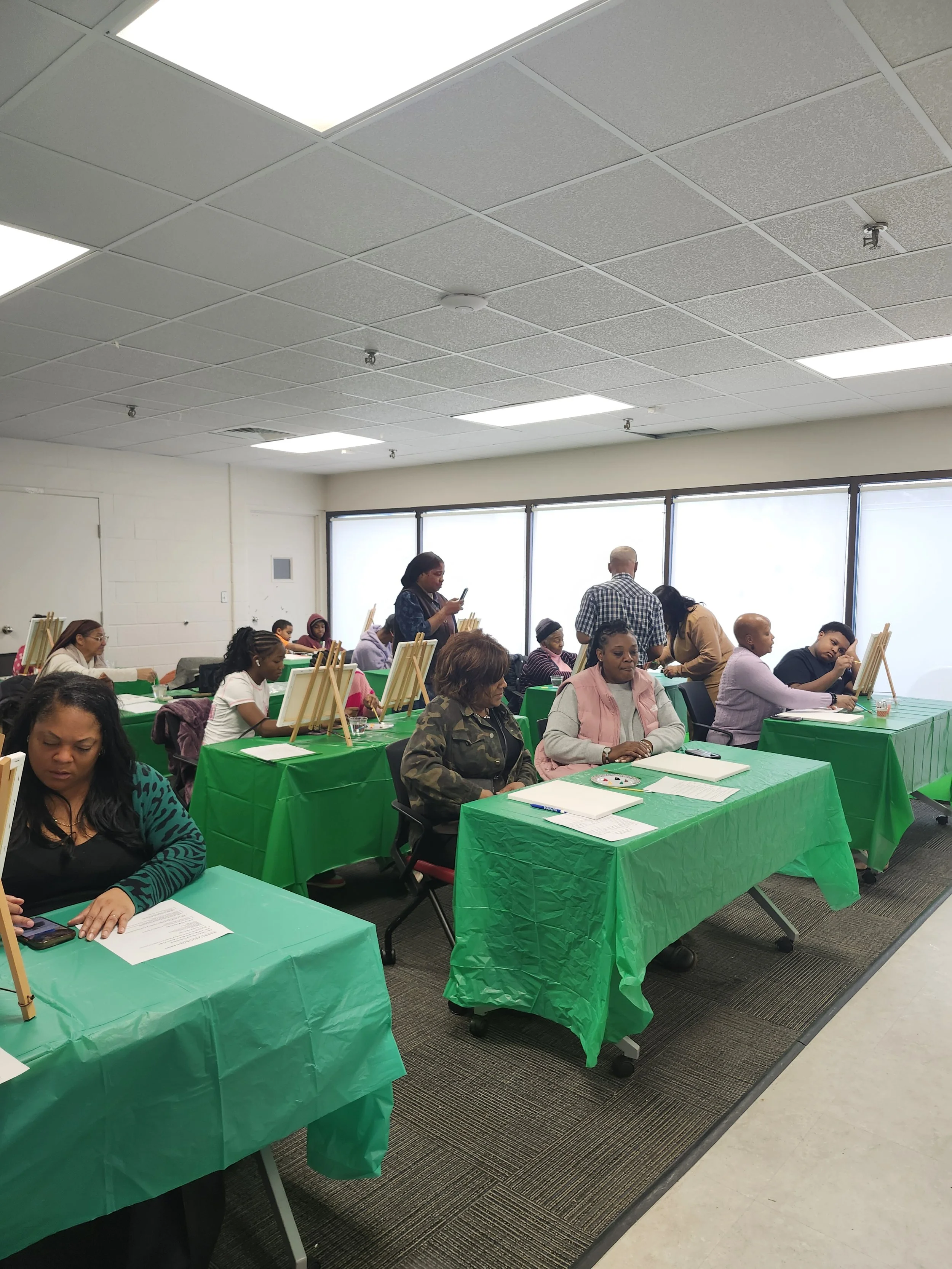 Community members participating in a hands on educational workshop at Efinity Harvest in Trotwood, Ohio focused on creativity, skill building, and community engagement