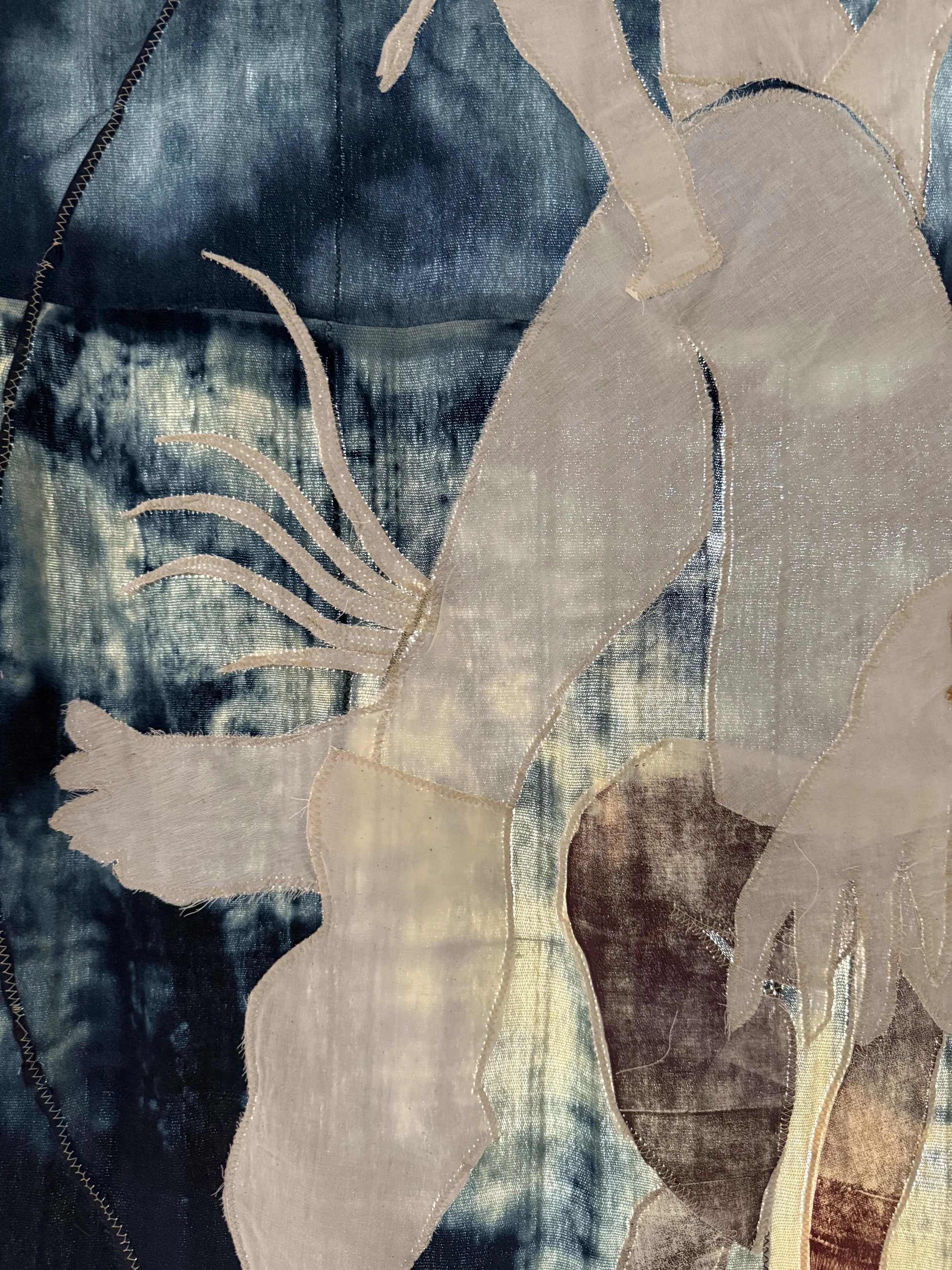 "Blue Mama" (2026) (Detail, Afternoon Light) 57" x 50" Muslin, cotton, coffee, cochineal dye, fabric relief print on bleached indigo shawls 
