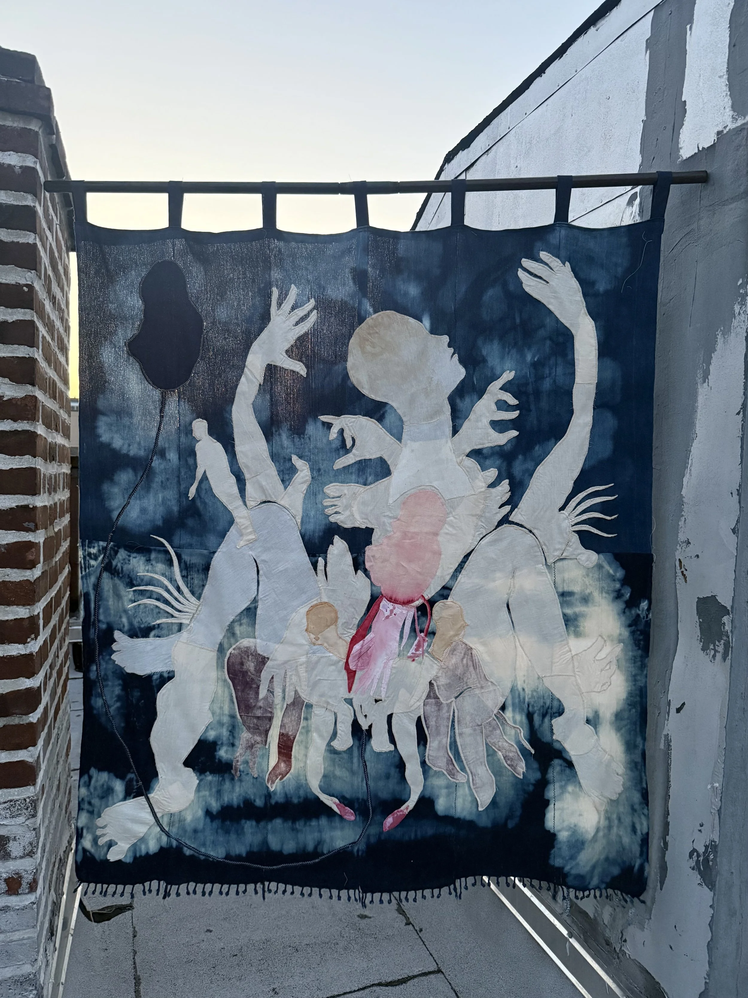 "Blue Mama" (2026)  57" x 50" Muslin, cotton, coffee, cochineal dye, fabric relief print on bleached indigo shawls (In Limited Backlight) $8,000