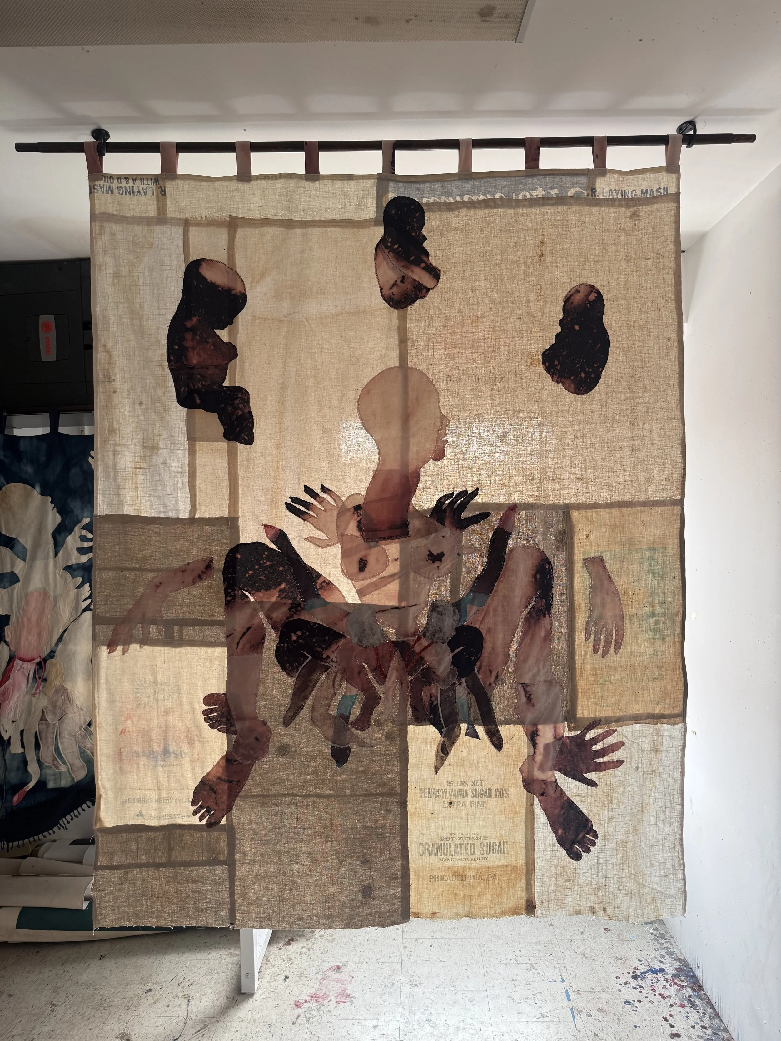 "Cecilia" (2026) (in afternoon light) 70" x 57" Bleached bedsheets, coffee, fluid watercolor, relief prints, used grain, seed and soap sacks, hand embroidery, $9,000