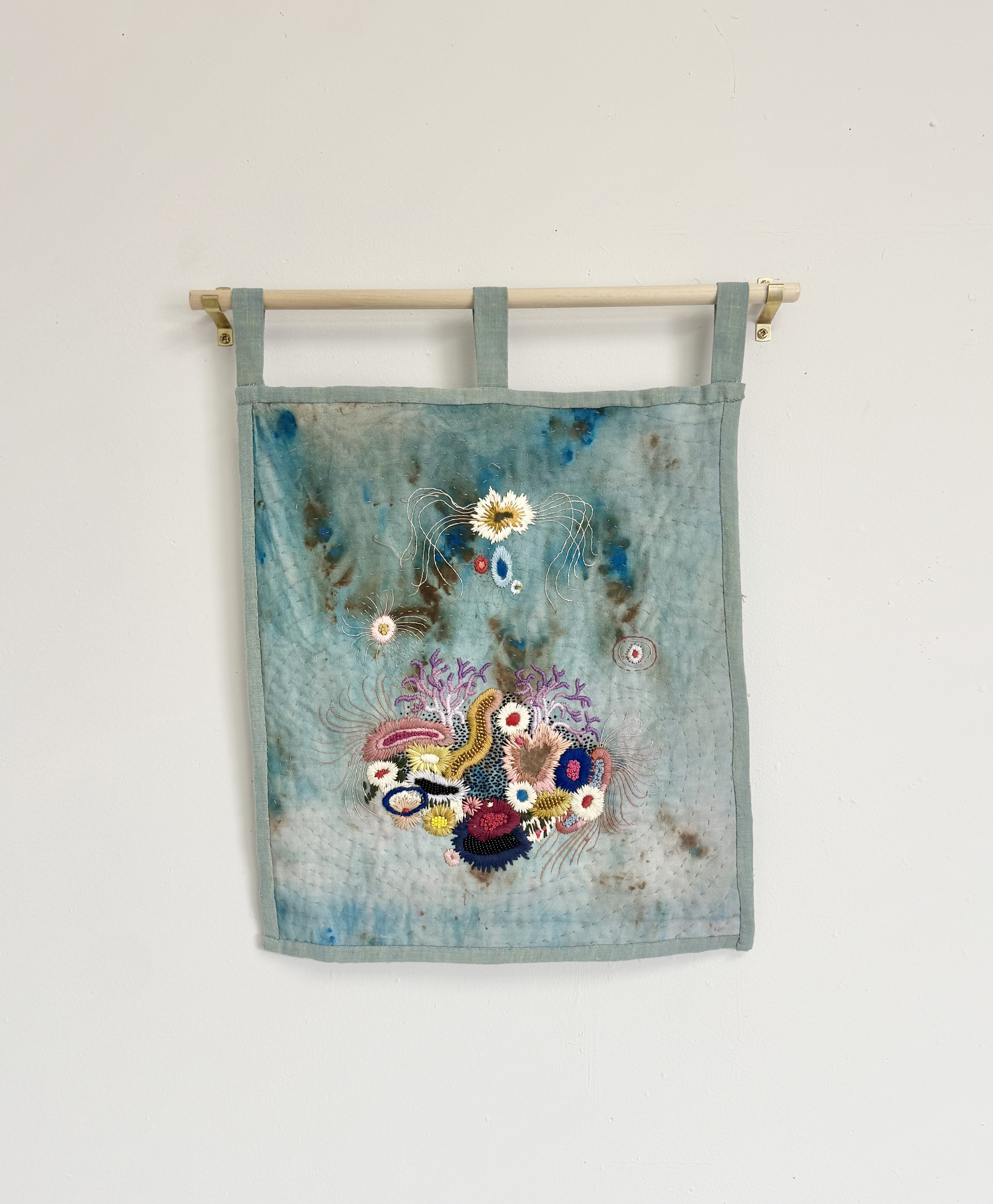 "Anemone Garden" (2024) 12" x 14" hand embroidery and beading on hand painted cotton, quilted $850