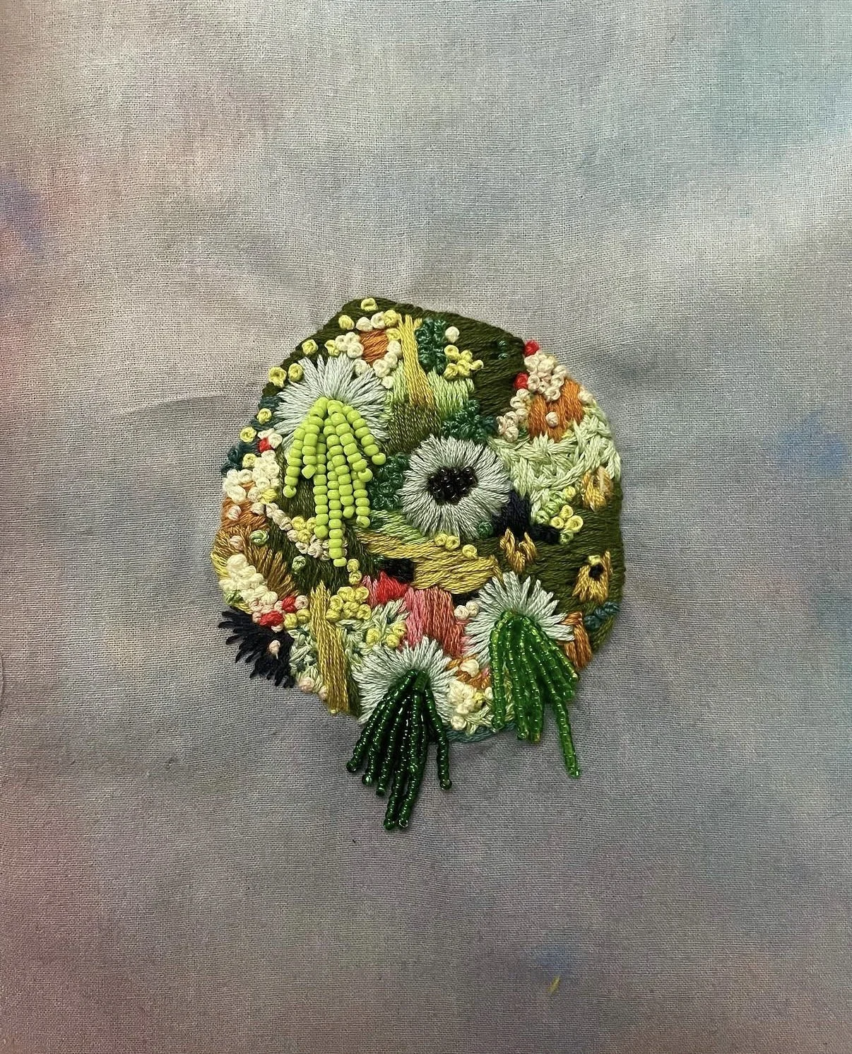 "Little World" (2024) "5.5" x 5.5" hand embroidery and beading on hand painted cotton SOLD
