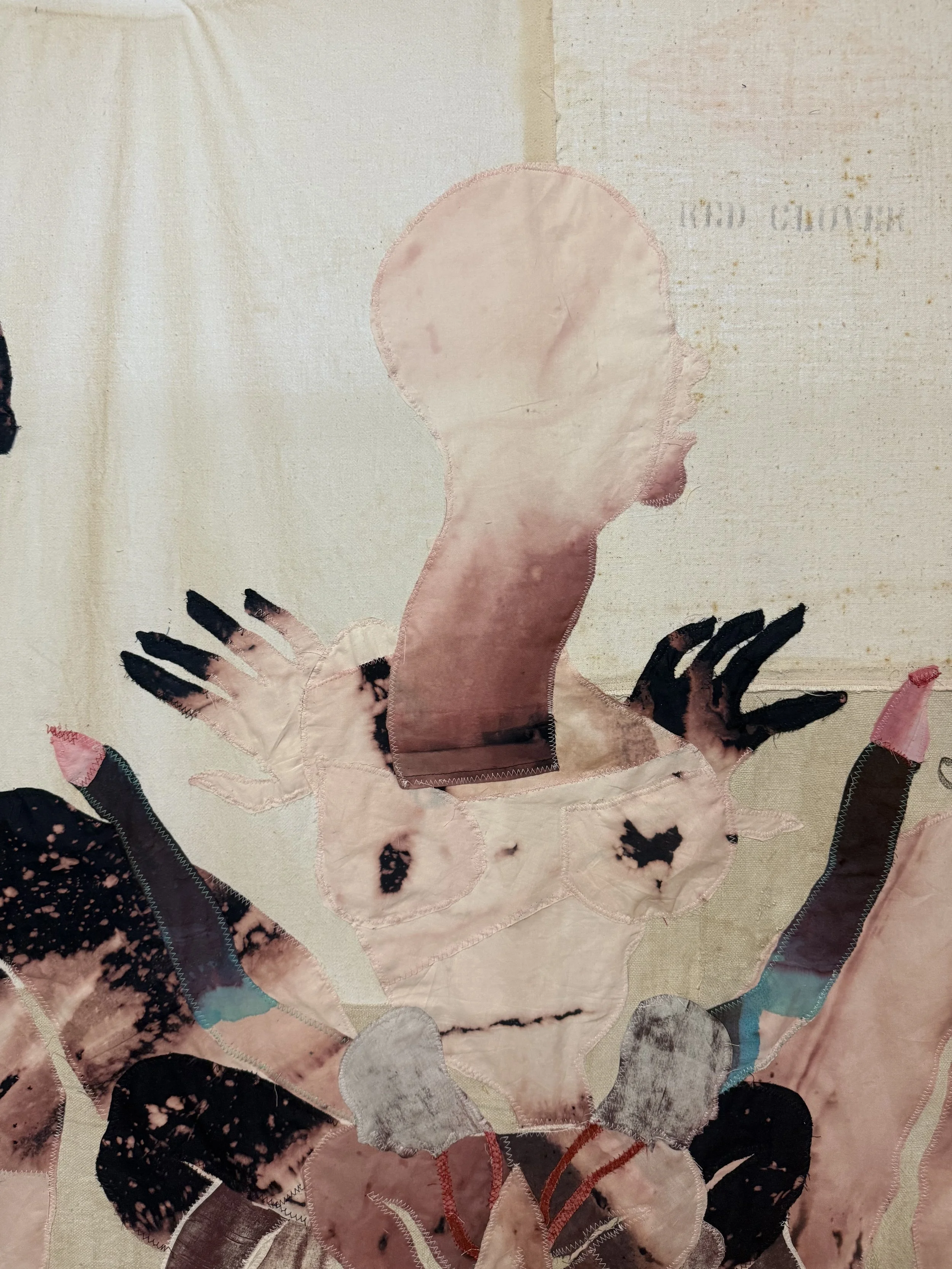 "Cecilia" (2026) (detail, no backlighting) 70" x 57" Bleached bedsheets, coffee, fluid watercolor, relief prints, used feed, seed and soap sacks, hand embroidery