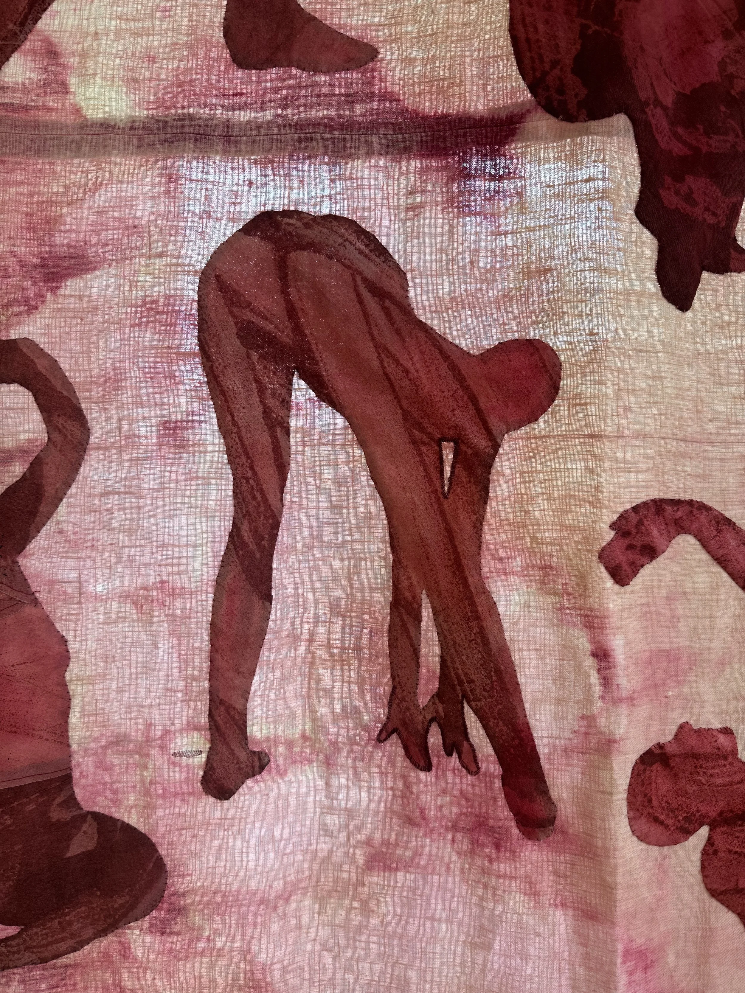 "Paper Dolls" (2026) (Detail in Afternoon Light) monotype on cotton appliqué hand stitched to cochineal dyed and bleached linen with hand embroidery $10,000