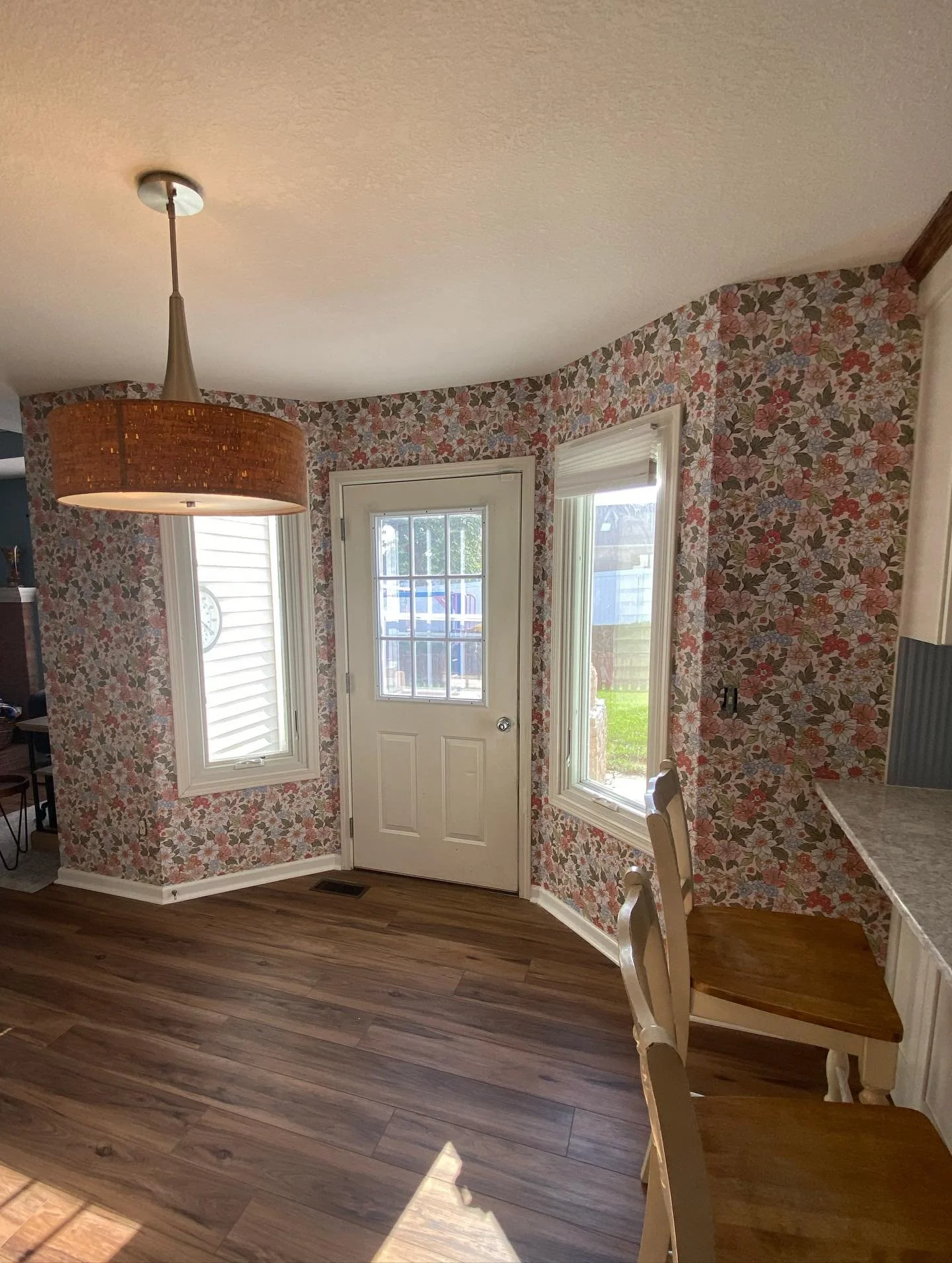 I loved being able to help bring this dining room to life with this wallpaper! The homeowner also had the great idea to tie in the kitchen by installing a section over their sink!