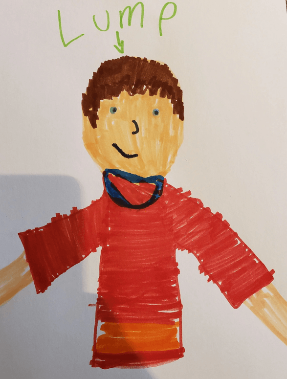 Child's drawing of a person with brown hair, wearing a red shirt and a blue and red neckerchief, labeled with green text 'Lump' with an arrow pointing to the head.